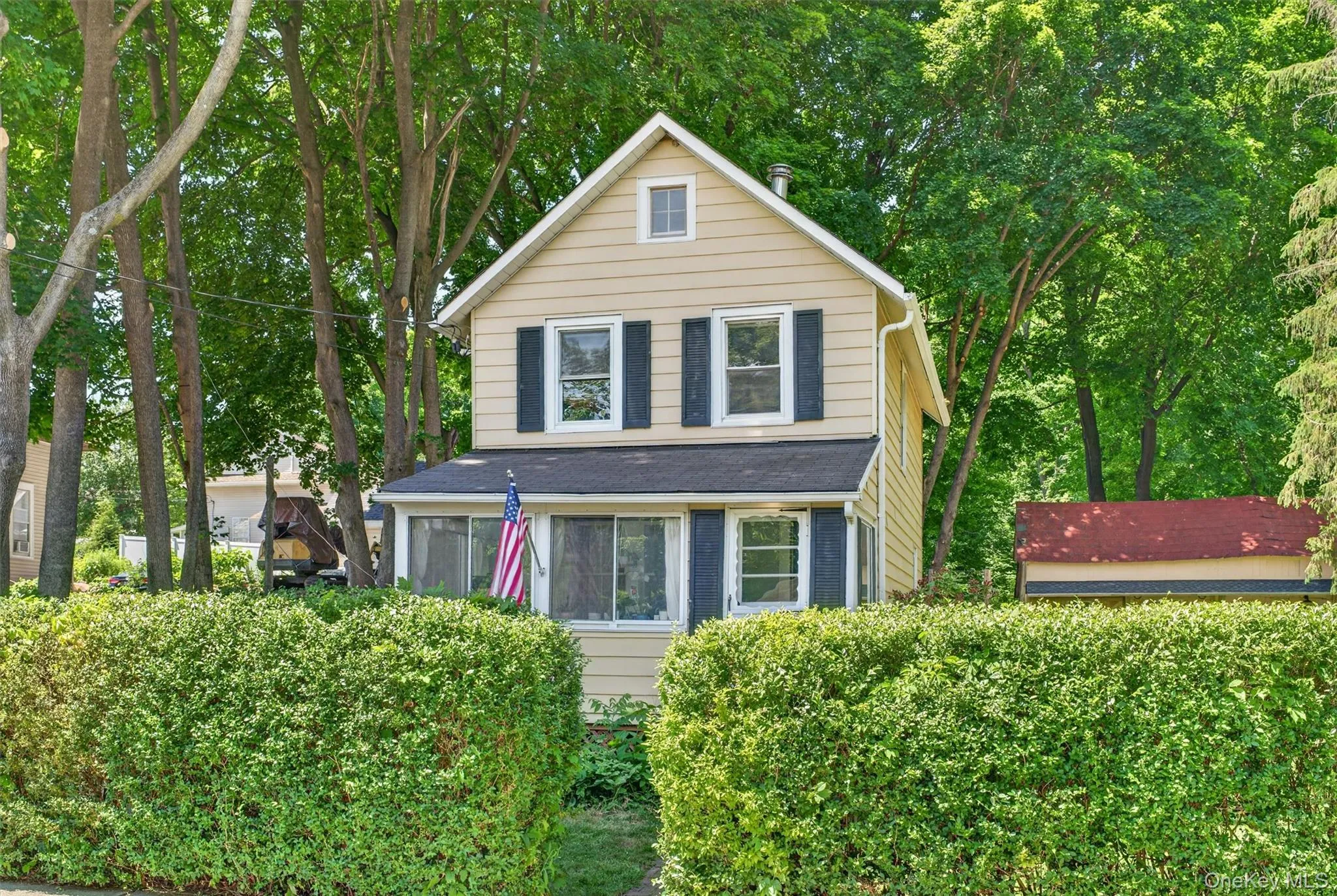 The manicured hedges offer privacy. The manicured hedges offer privacy.