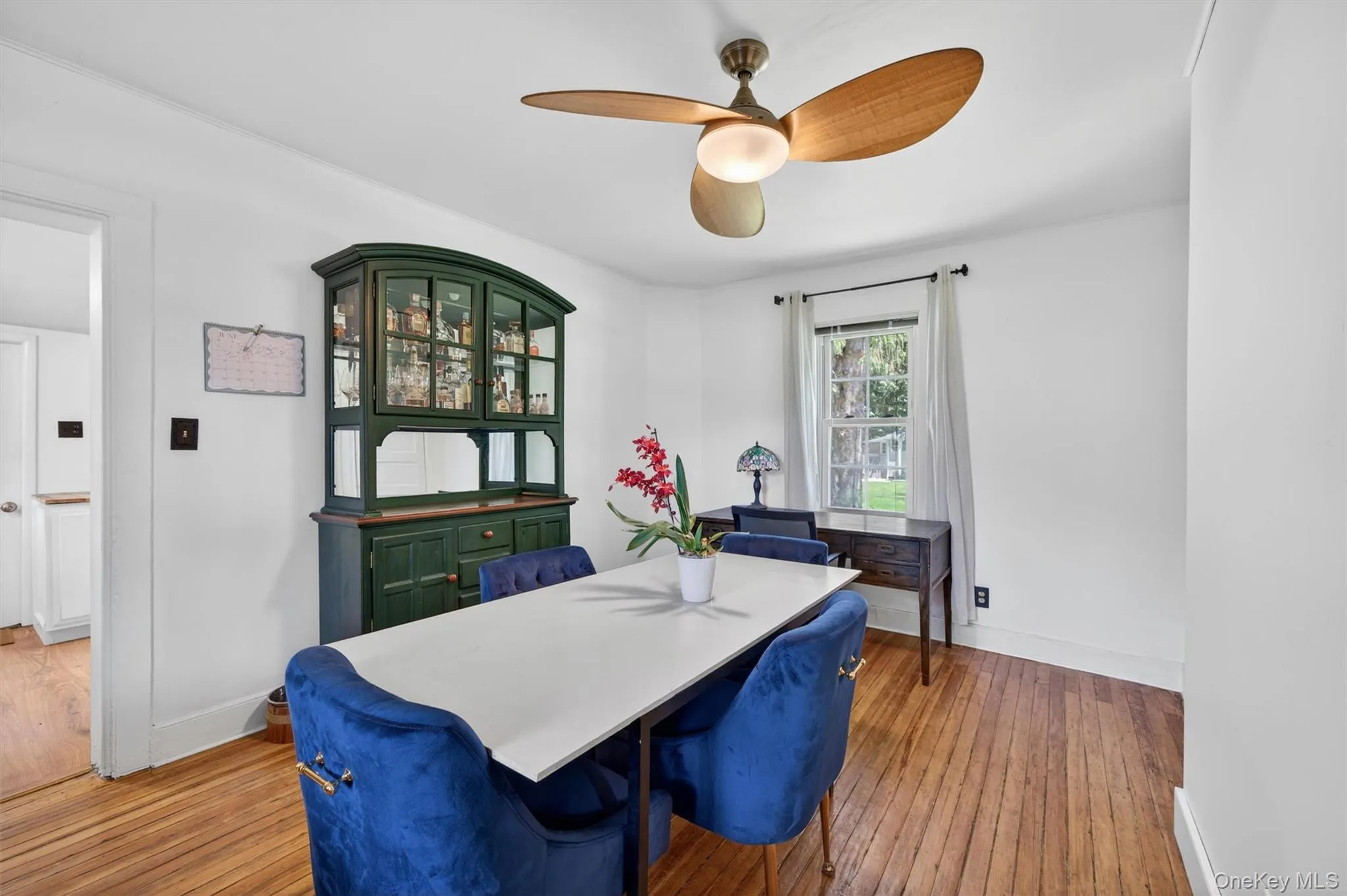 The dining room ceiling fan keeps things cool. The dining room ceiling fan keeps things cool.