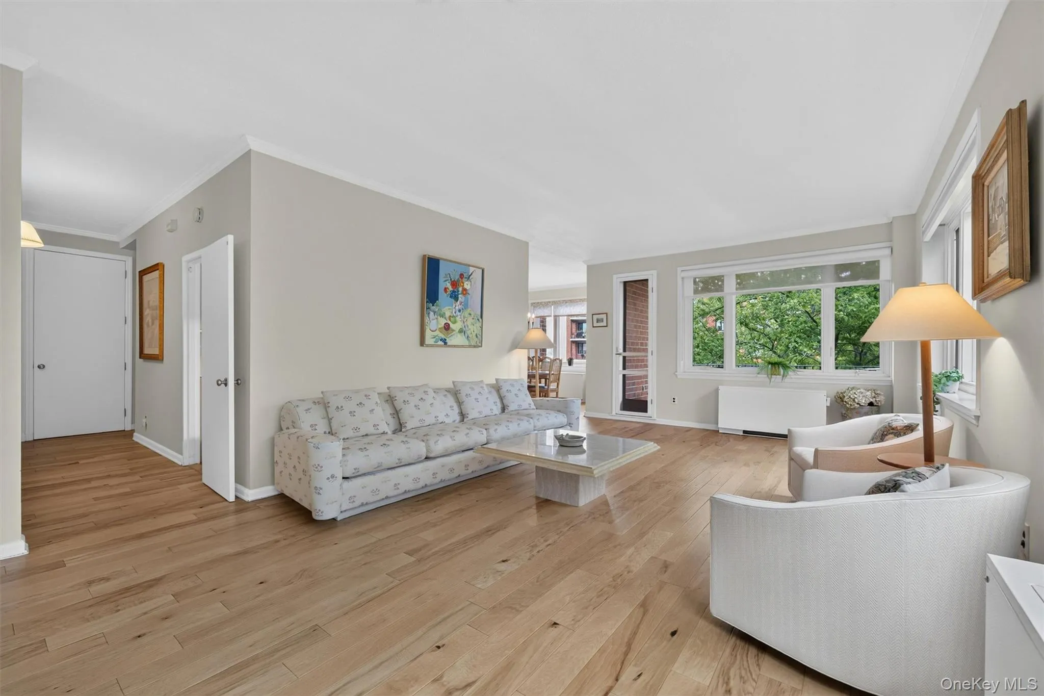 Beautiful wood floors extend from foyer through living to dining room. Beautiful wood floors extend from foyer through living to dining room.