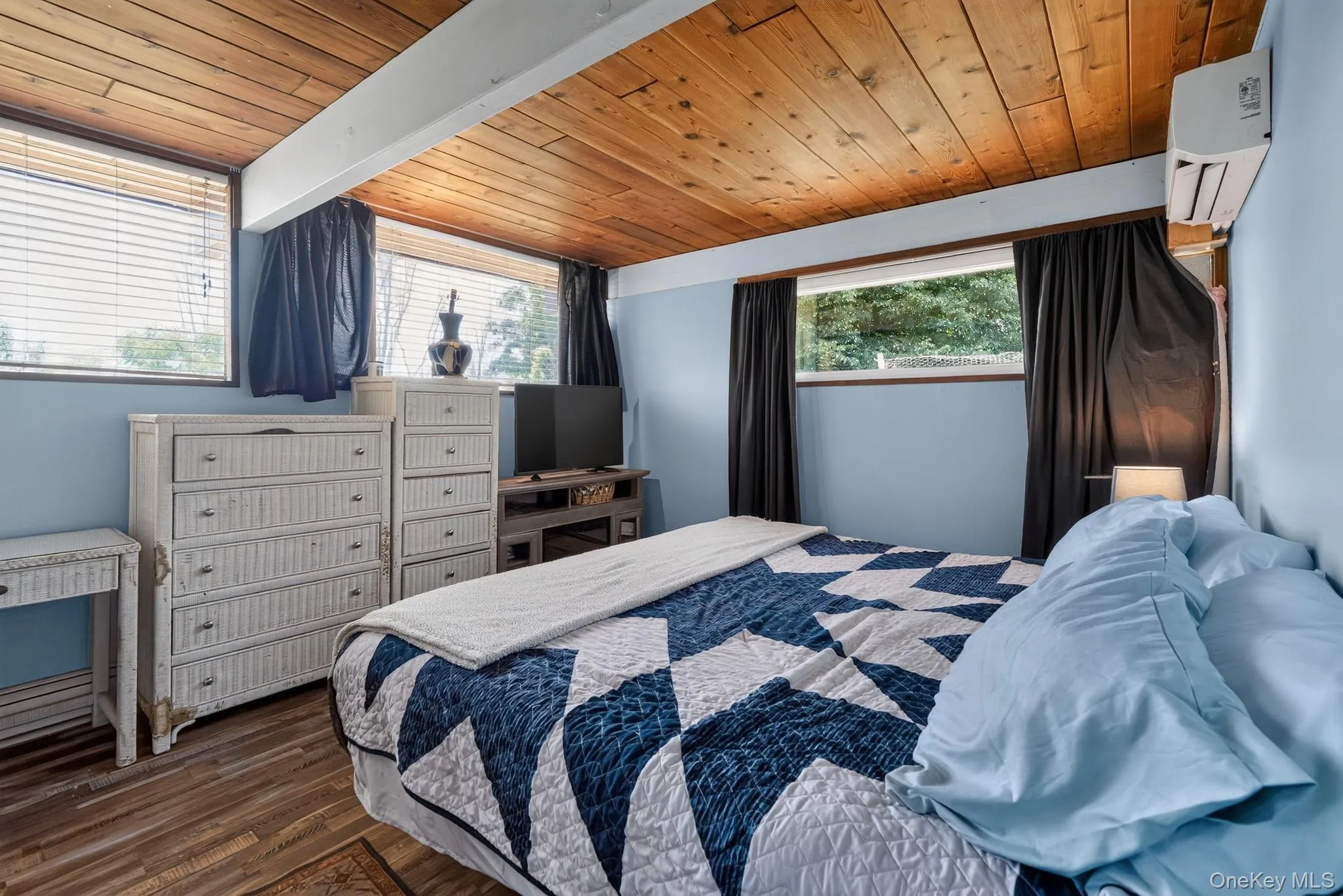 Wood-plank ceiling with exposed beams Wood-plank ceiling with exposed beams