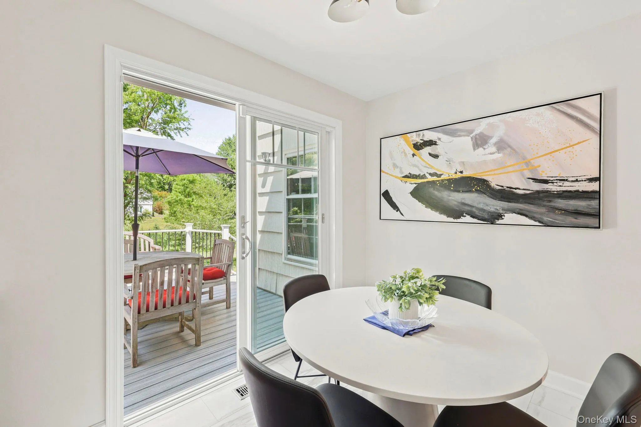 Sliding doors to deck off of kitchen dining area Sliding doors to deck off of kitchen dining area