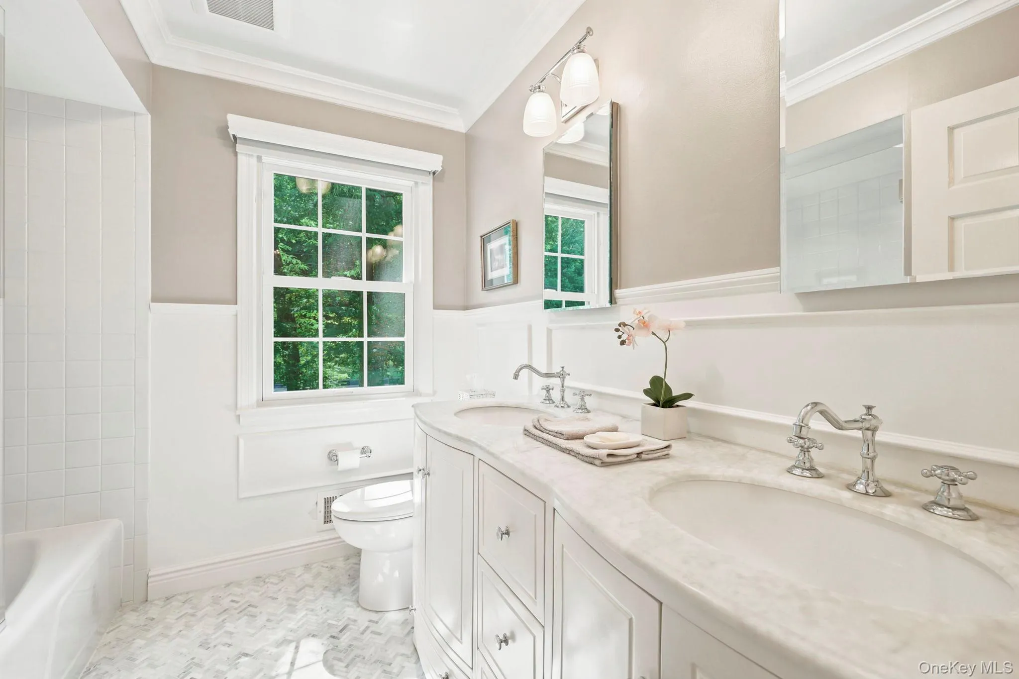 Full hall bathroom with dual sink vanity and tub Full hall bathroom with dual sink vanity and tub
