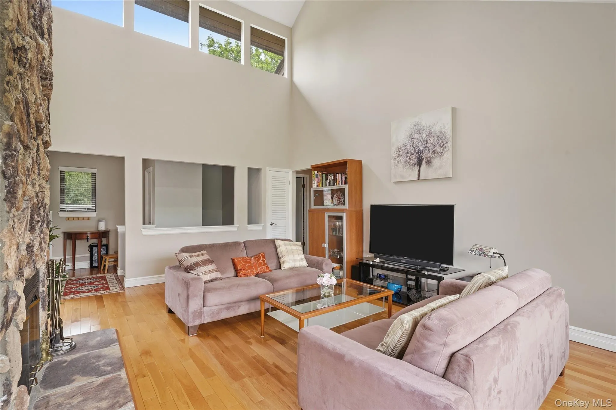 Living room with full view of skylights and cathedral ceiling. Living room with full view of skylights and cathedral ceiling.