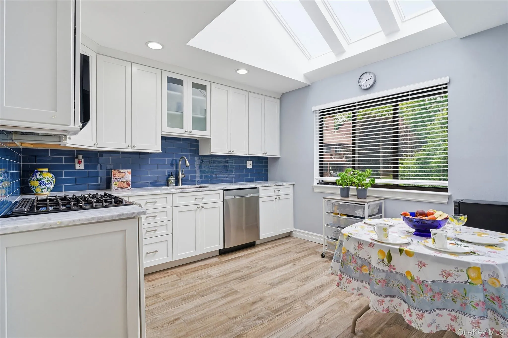 Updated EIK with Quartzite Countertops, Stainless Steel Appliances, and White Cabinets. Updated EIK with Quartzite Countertops, Stainless Steel Appliances, and White Cabinets.
