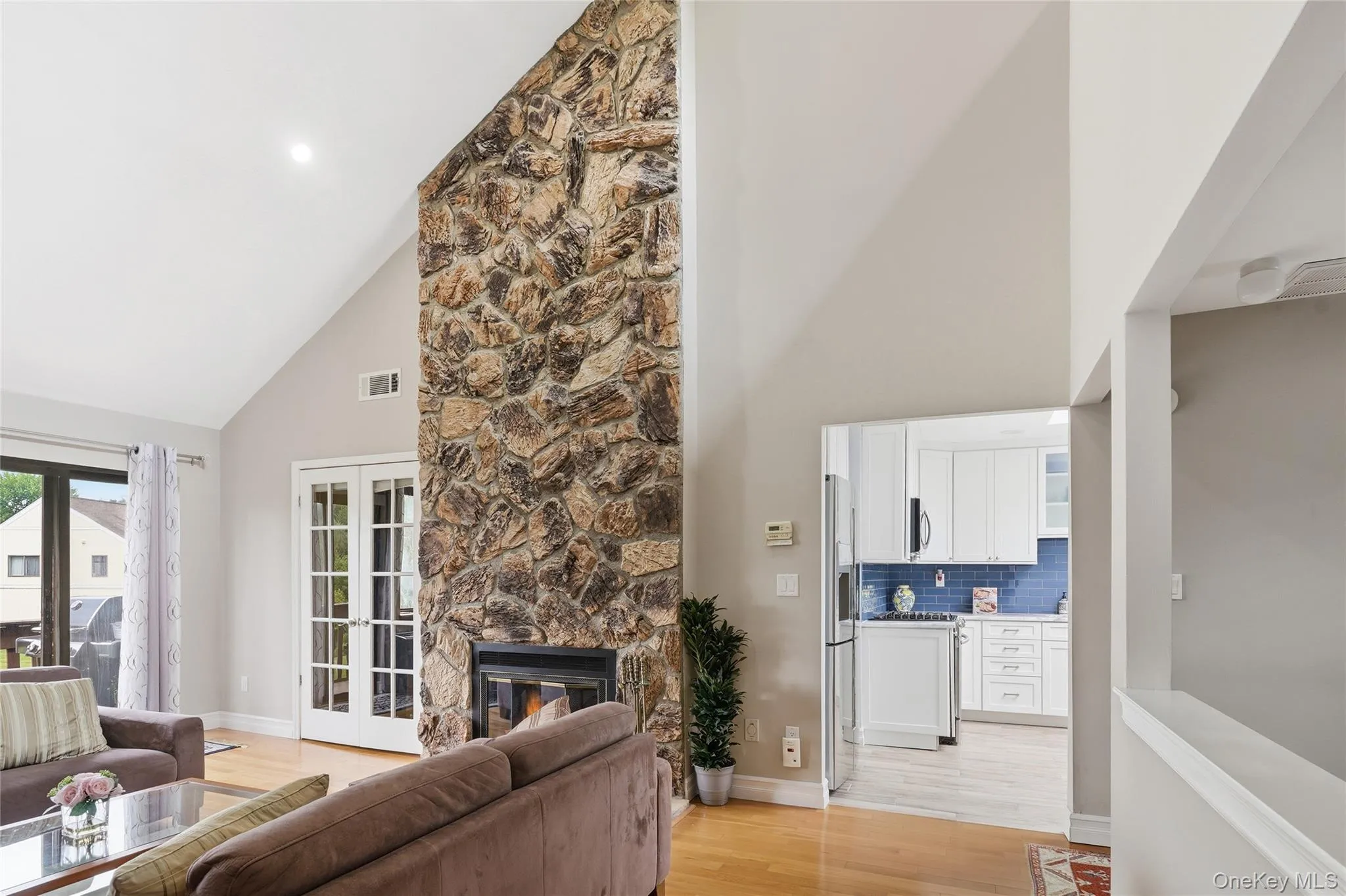 Living Room with view Stone fireplace . Living Room with view Stone fireplace .