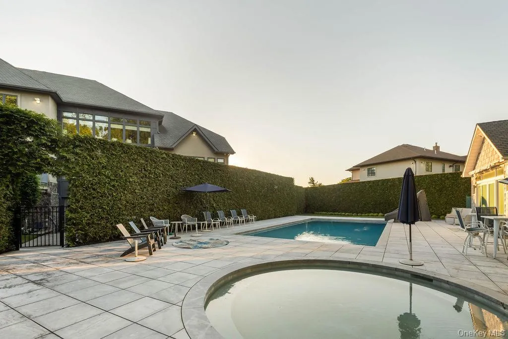Outdoor pool and spa with extensive paver patio Outdoor pool and spa with extensive paver patio