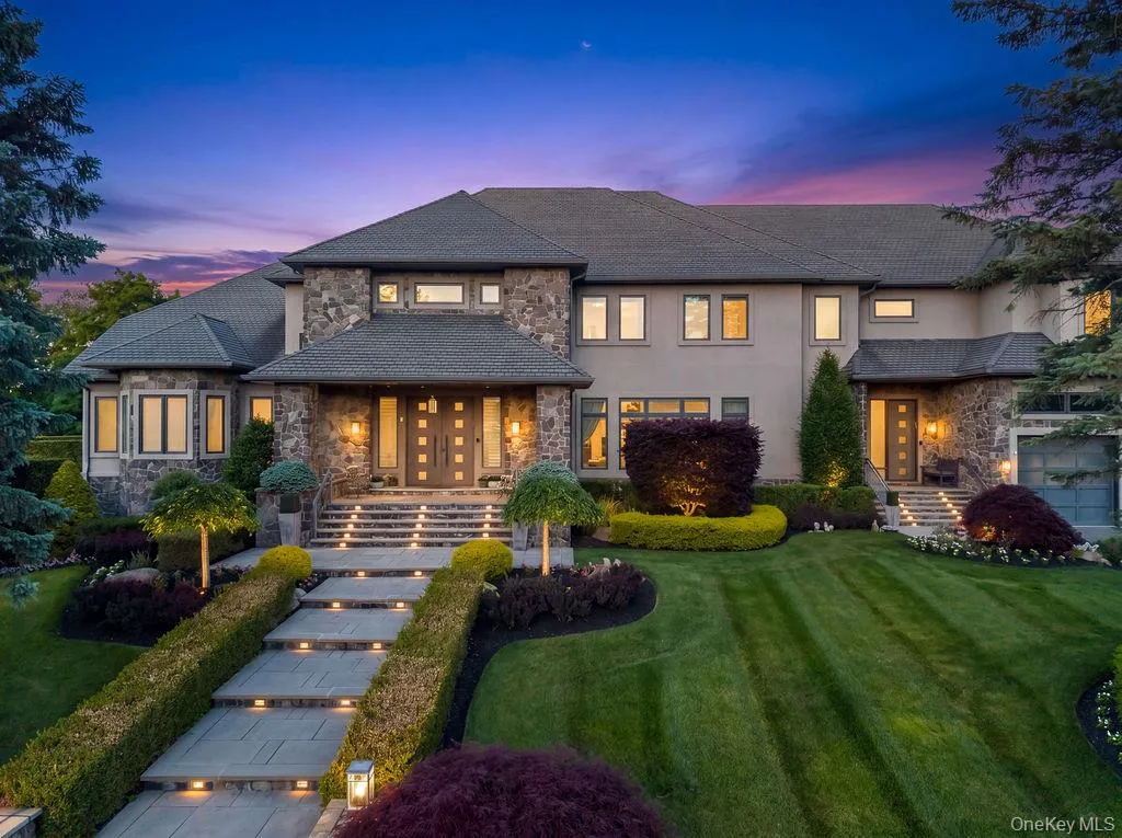 Stately stone and stucco exterior with multiple gabled rooflines Stately stone and stucco exterior with multiple gabled rooflines