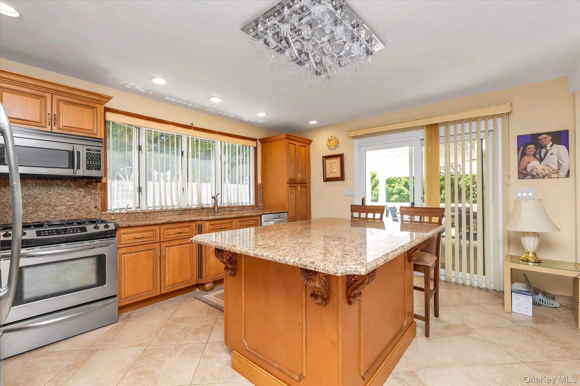 Lower-level kitchen with gas stove. Sliders to Lower patio, In-Law Living Lower-level kitchen with gas stove. Sliders to Lower patio, In-Law Living