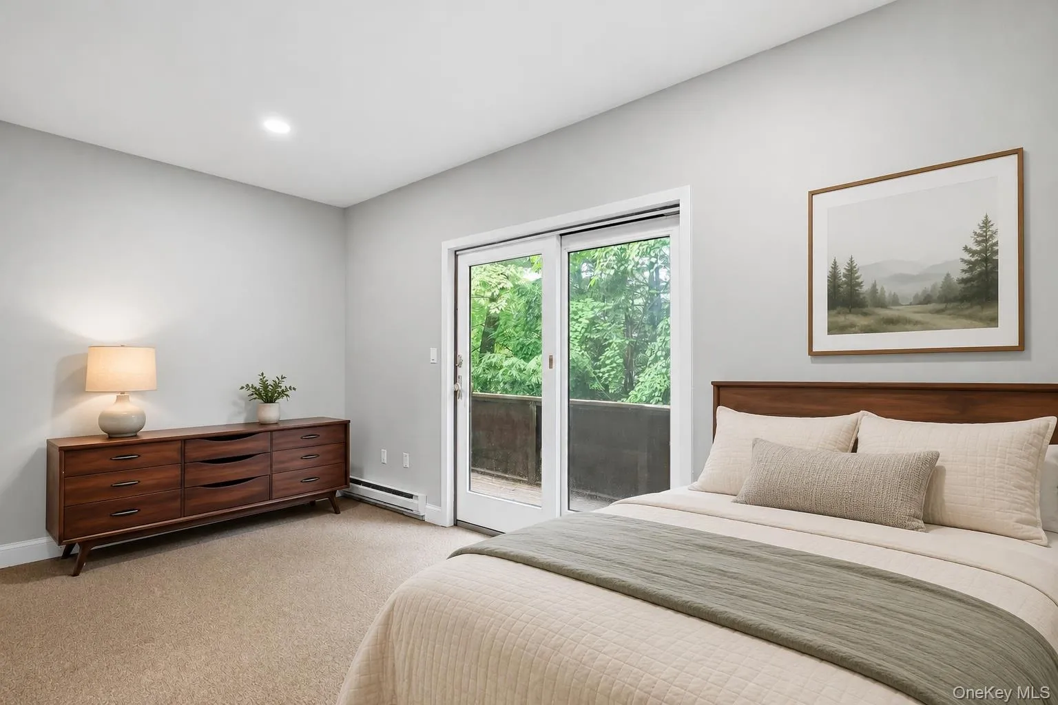 Lower level bedroom with sliders *virtually staged Lower level bedroom with sliders *virtually staged