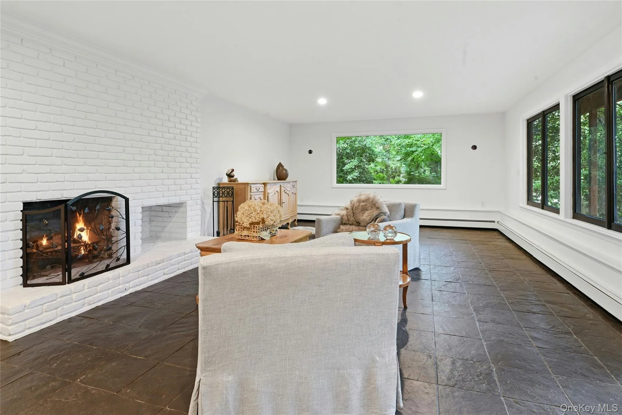 Lower level living room with wood burning fireplace Lower level living room with wood burning fireplace
