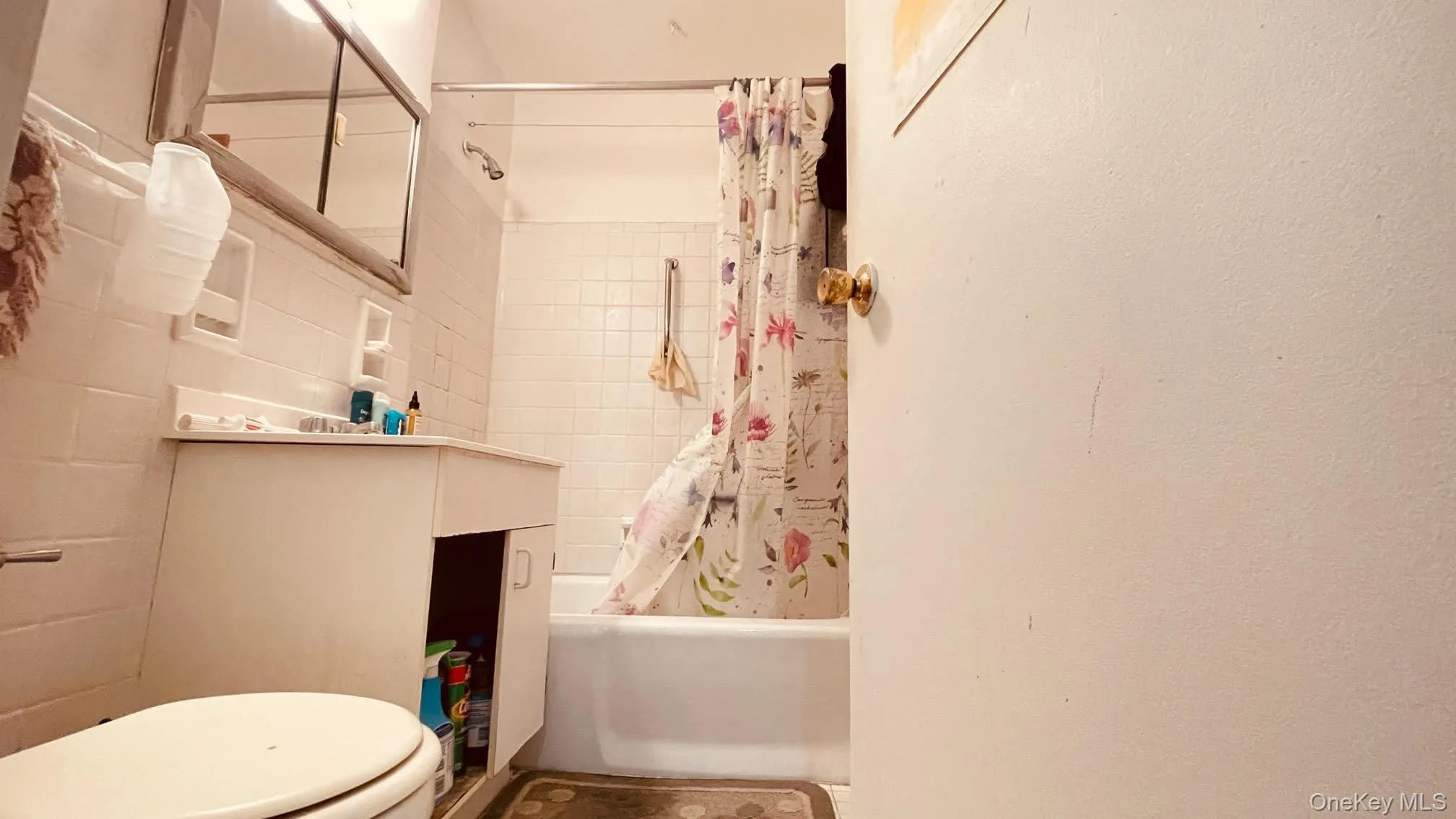Full bathroom with shower / tub combo and vanity Full bathroom with shower / tub combo and vanity