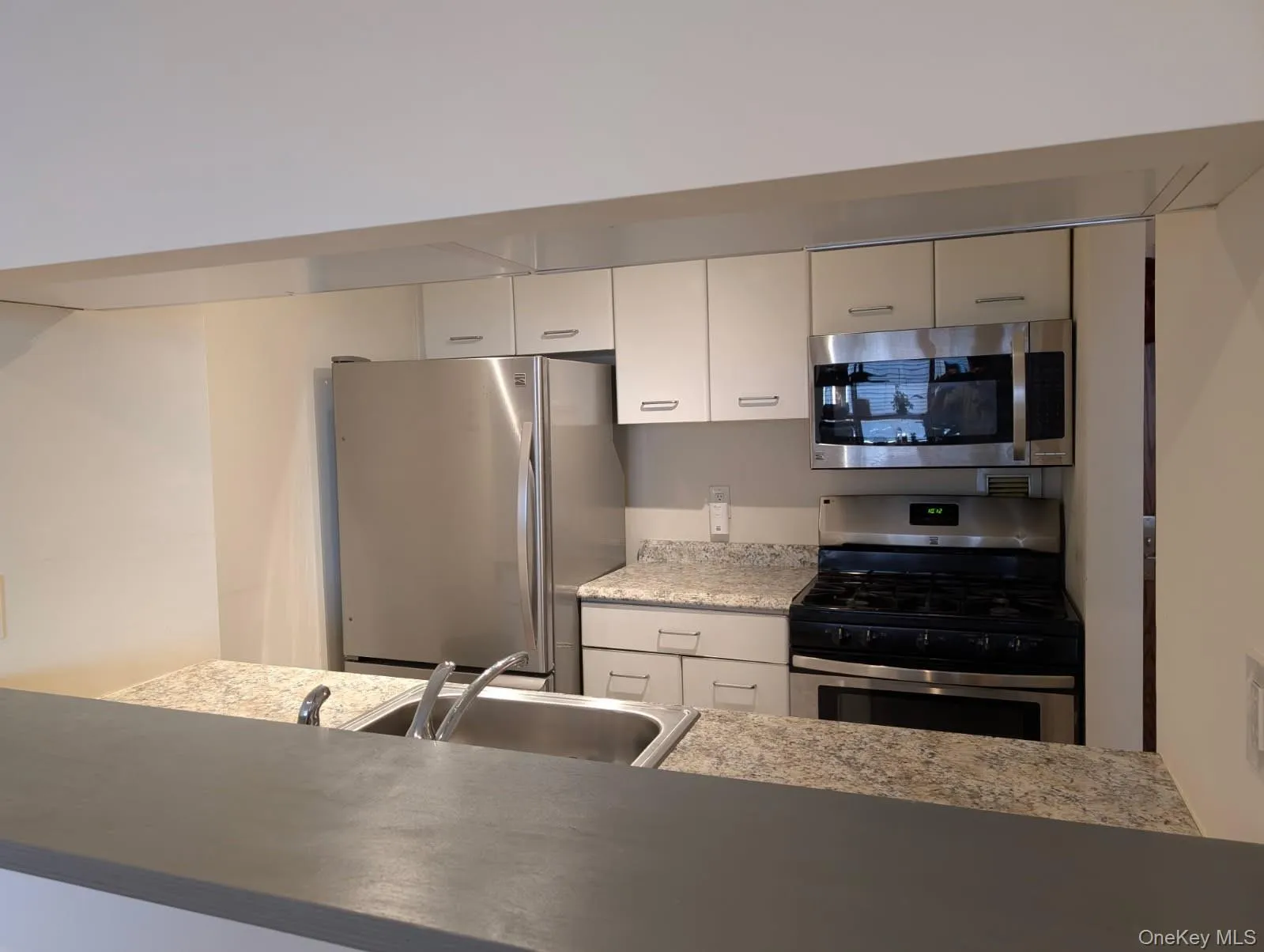 Kitchen featuring a sink, appliances with stainless steel appliances Kitchen featuring a sink, appliances with stainless steel appliances