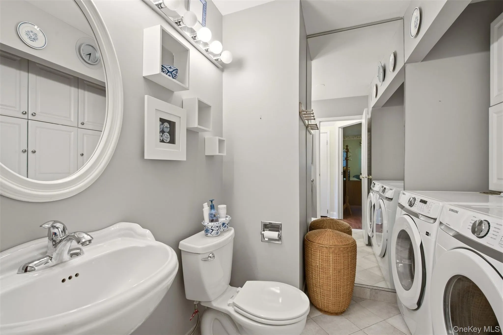 Half bathroom with laundry area. Half bathroom with laundry area.