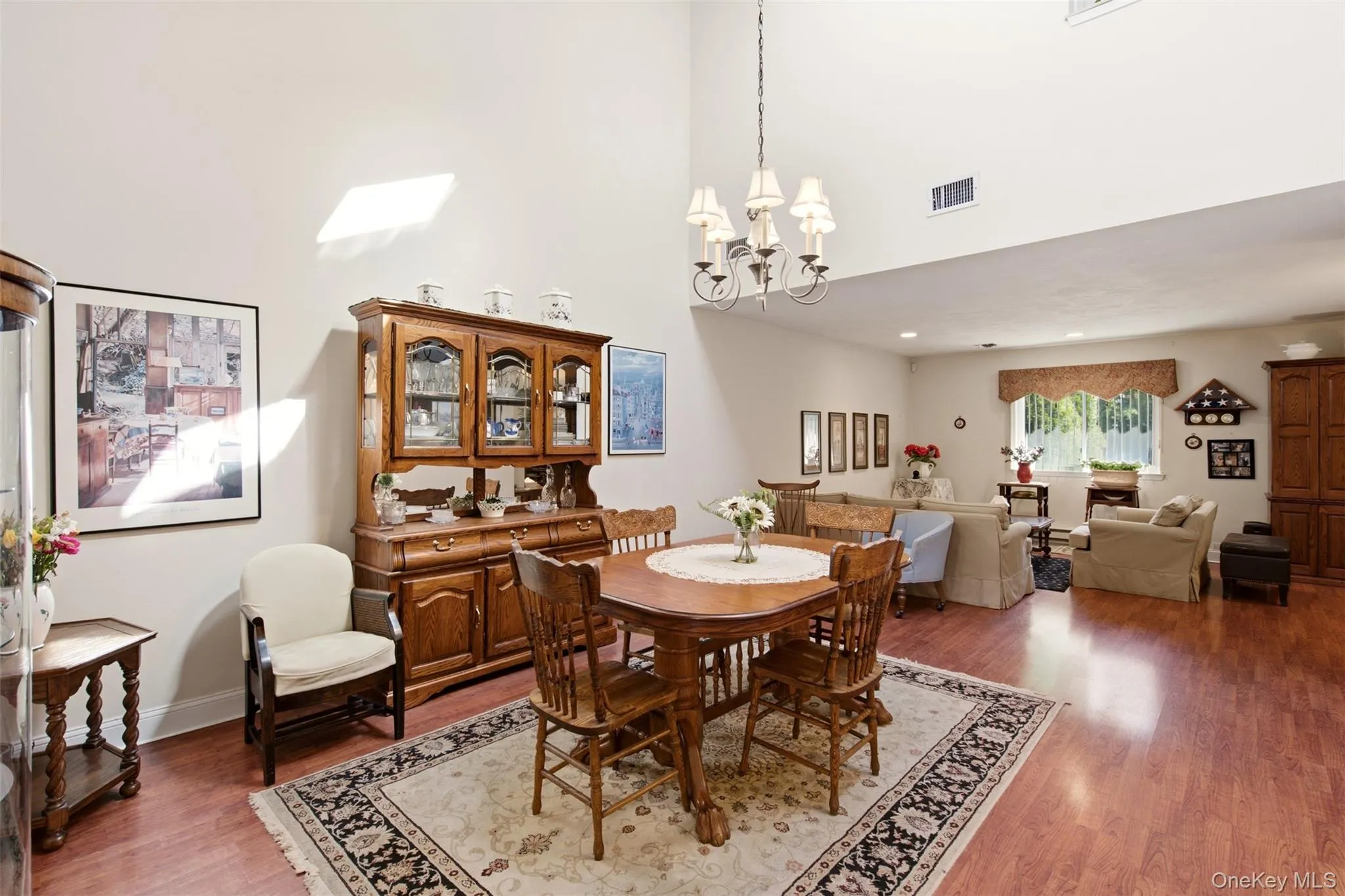Dining room featuring raised ceiling and skylight. Dining room featuring raised ceiling and skylight.