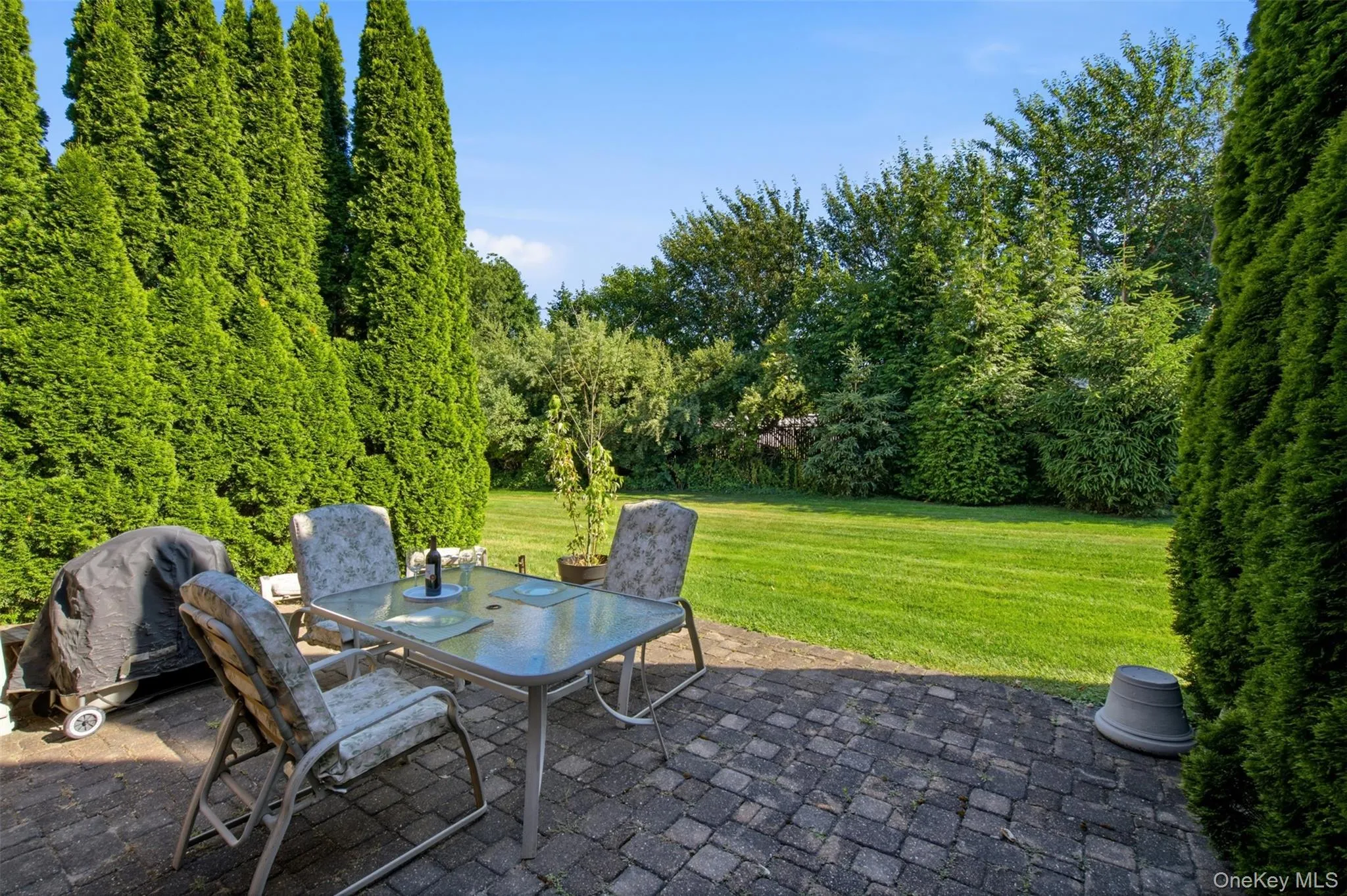 Outdoor space with paver patio. Outdoor space with paver patio.