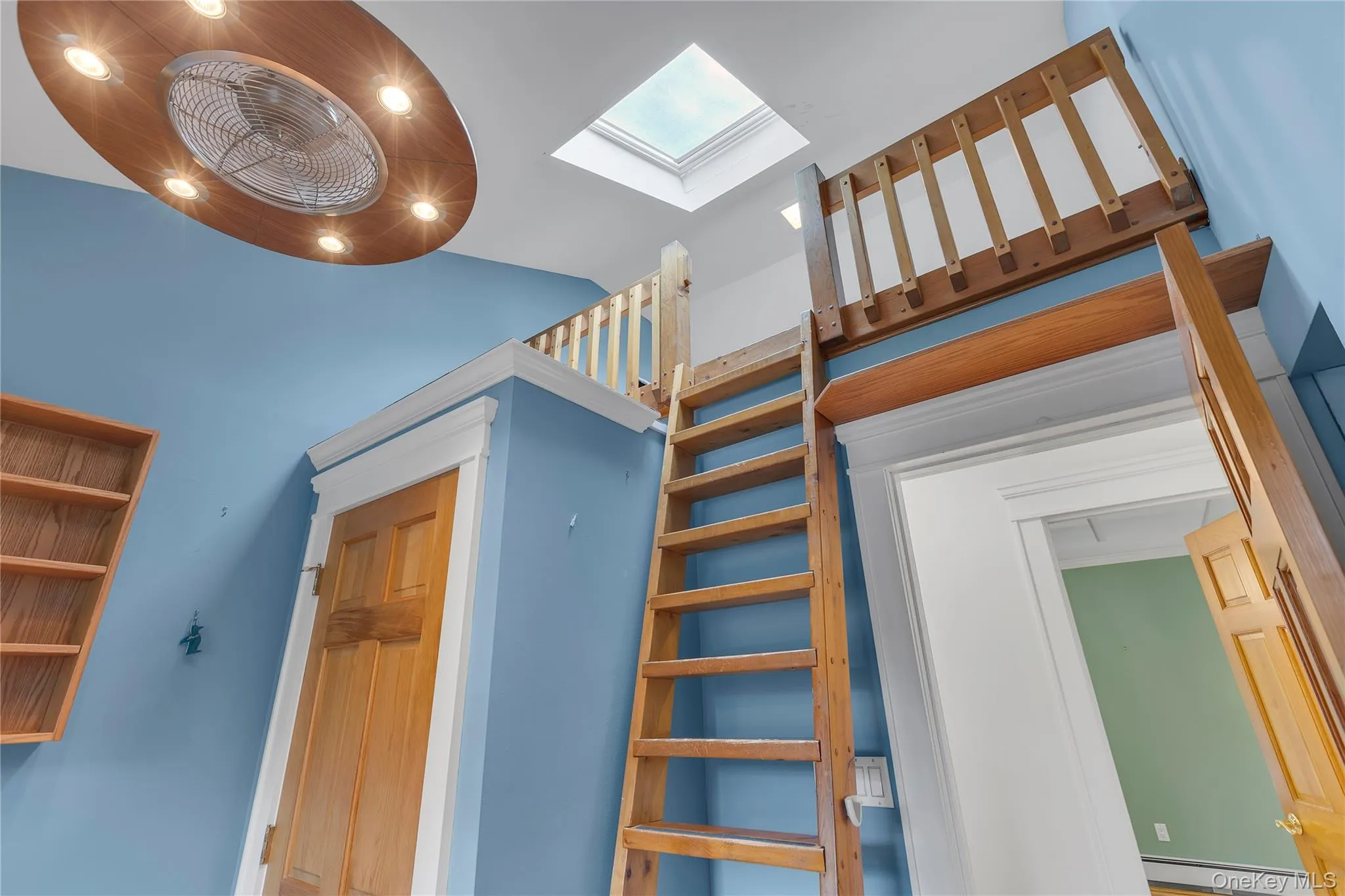Bedroom with loft with skylight and closet. Bedroom with loft with skylight and closet.