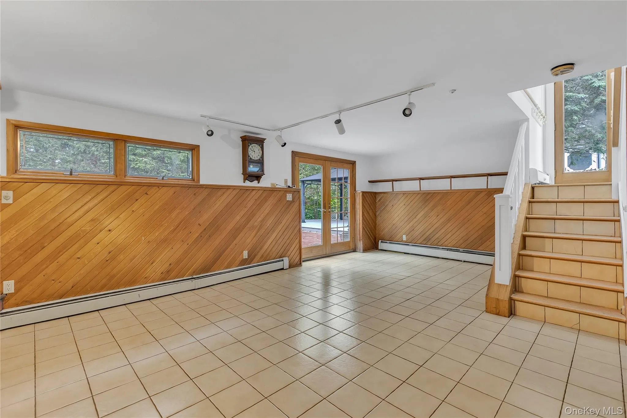 Staircase to lower den level. Walk out to backyard Staircase to lower den level. Walk out to backyard