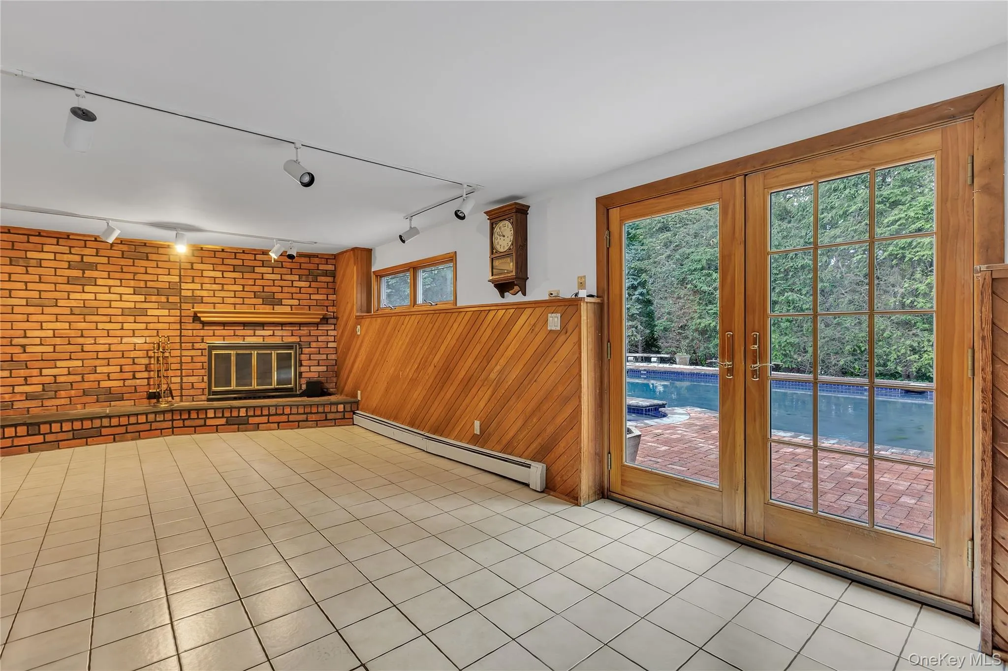 Access from french doors to backyard and inground solar heated gunite pool. Access from french doors to backyard and inground solar heated gunite pool.