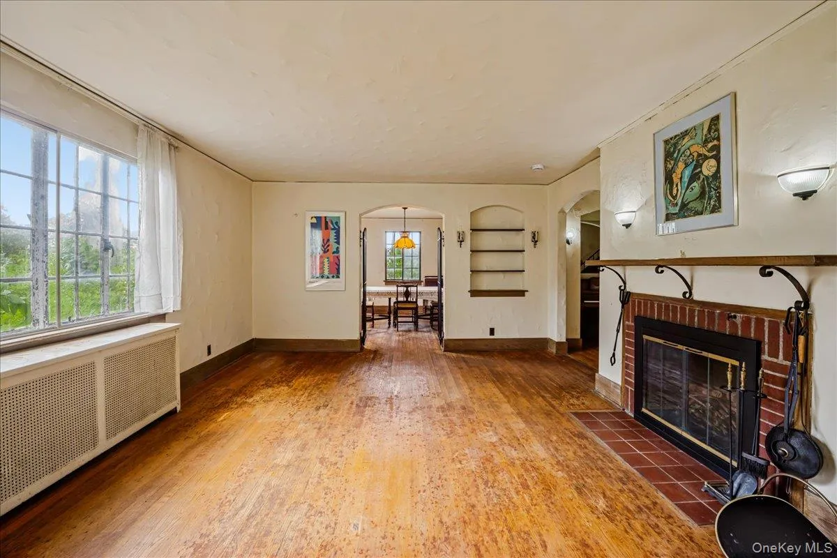 Living Room with wood burning fireplace and hardwood floors Living Room with wood burning fireplace and hardwood floors