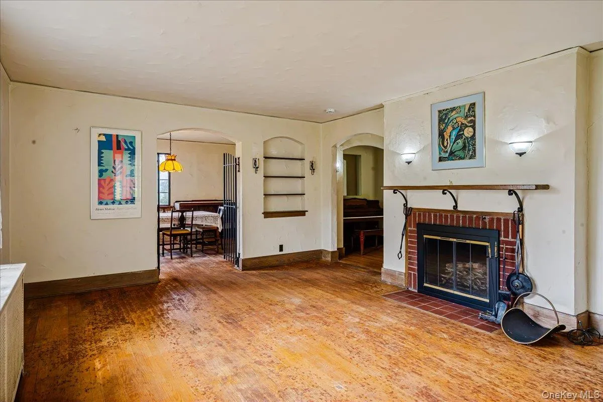 Living Room with wood burning fireplace and hardwood floors Living Room with wood burning fireplace and hardwood floors