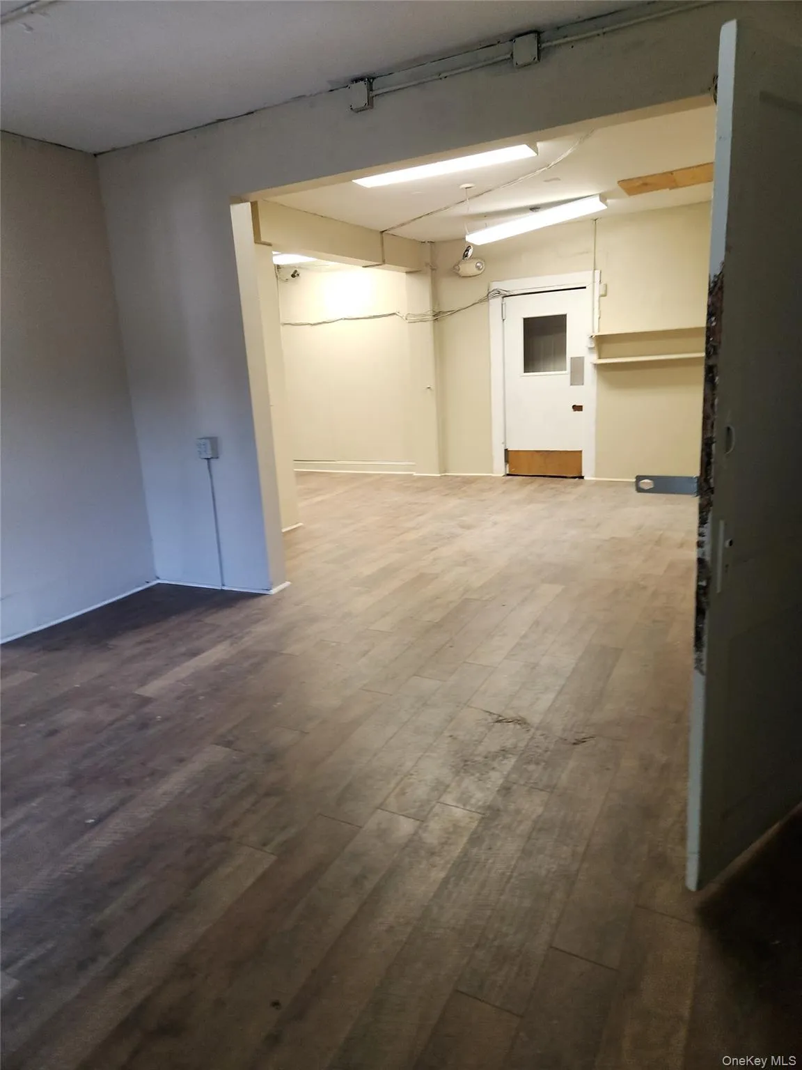 Spare room featuring dark wood finished floors Spare room featuring dark wood finished floors