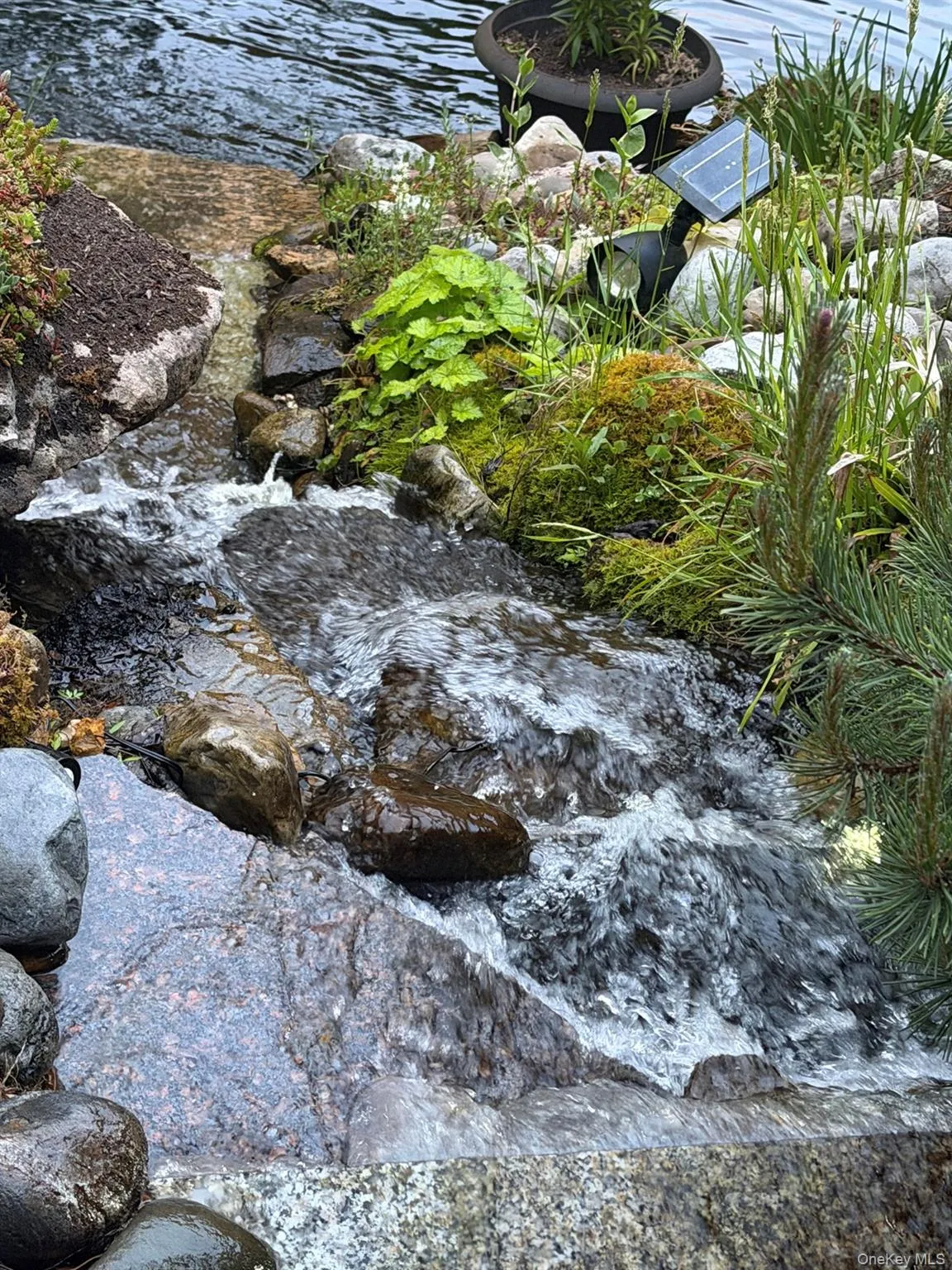 waterfall at koi pond waterfall at koi pond