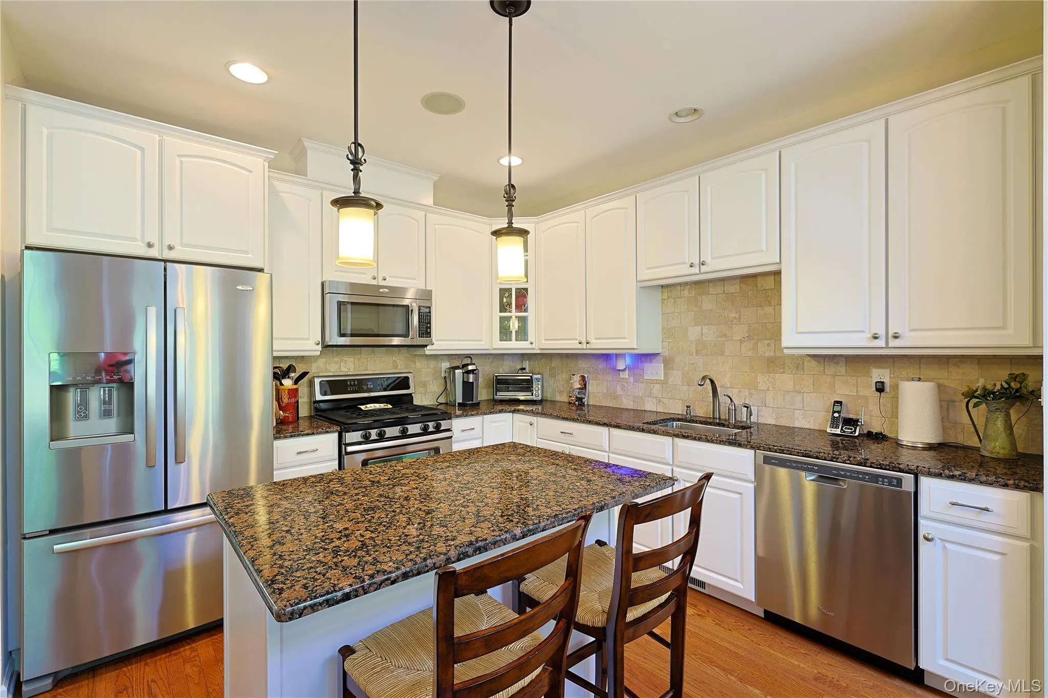 Kitchen with stainless steel appliance and granite counters Kitchen with stainless steel appliance and granite counters