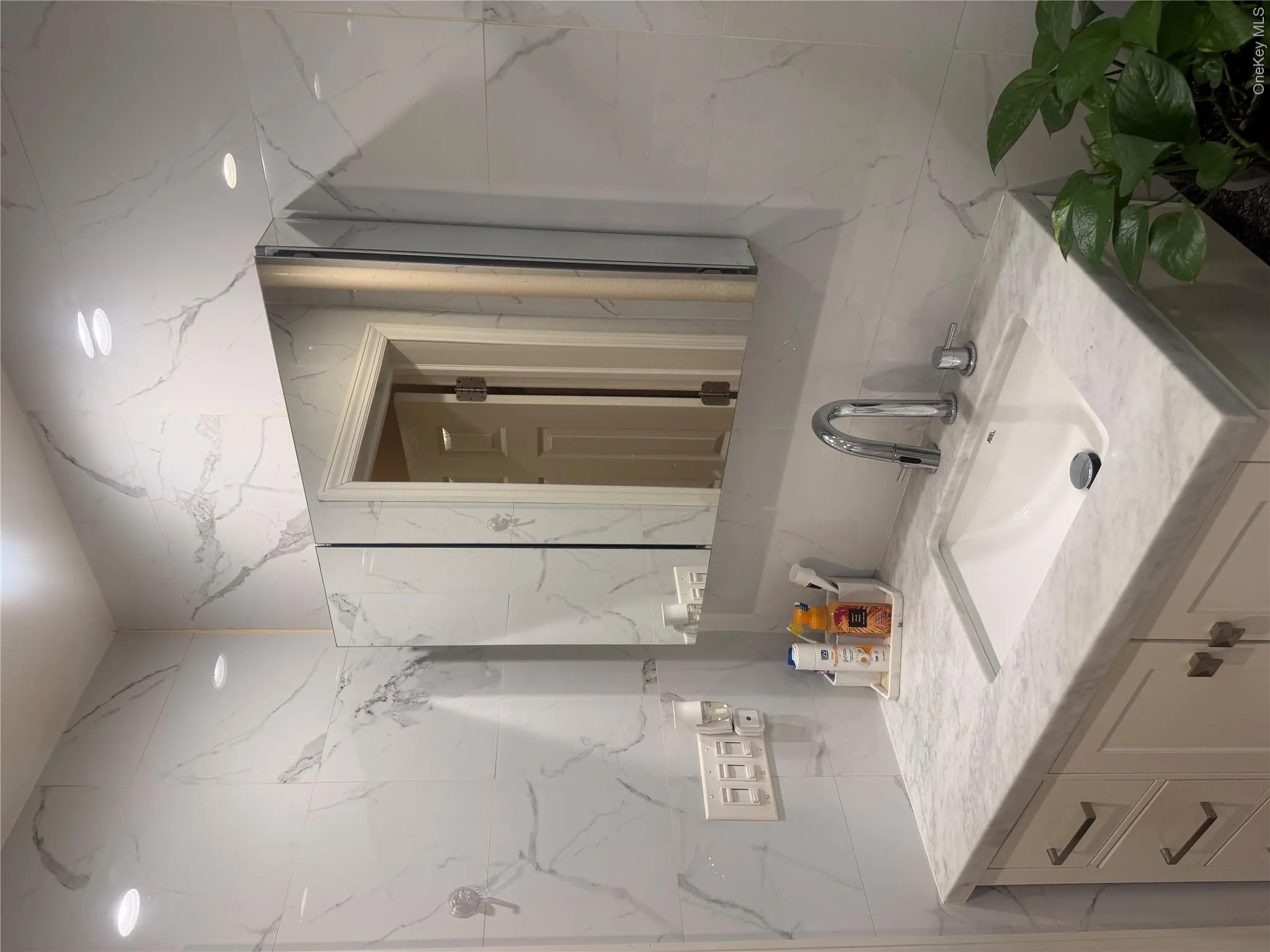 Bathroom granite countertop sink, marble tile walls throughout. Bathroom granite countertop sink, marble tile walls throughout.