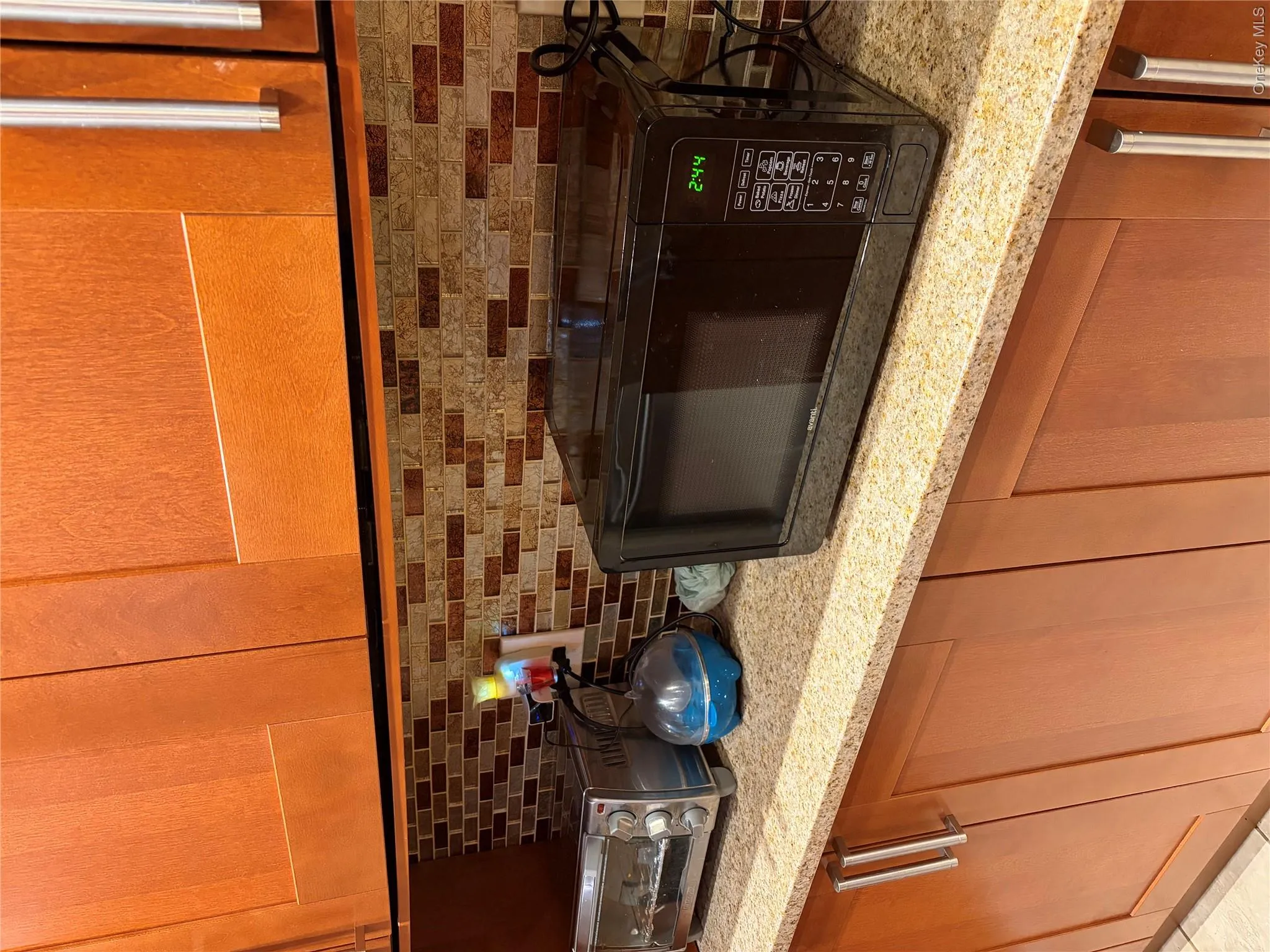 Kitchen granite counter tops across sink. Kitchen granite counter tops across sink.