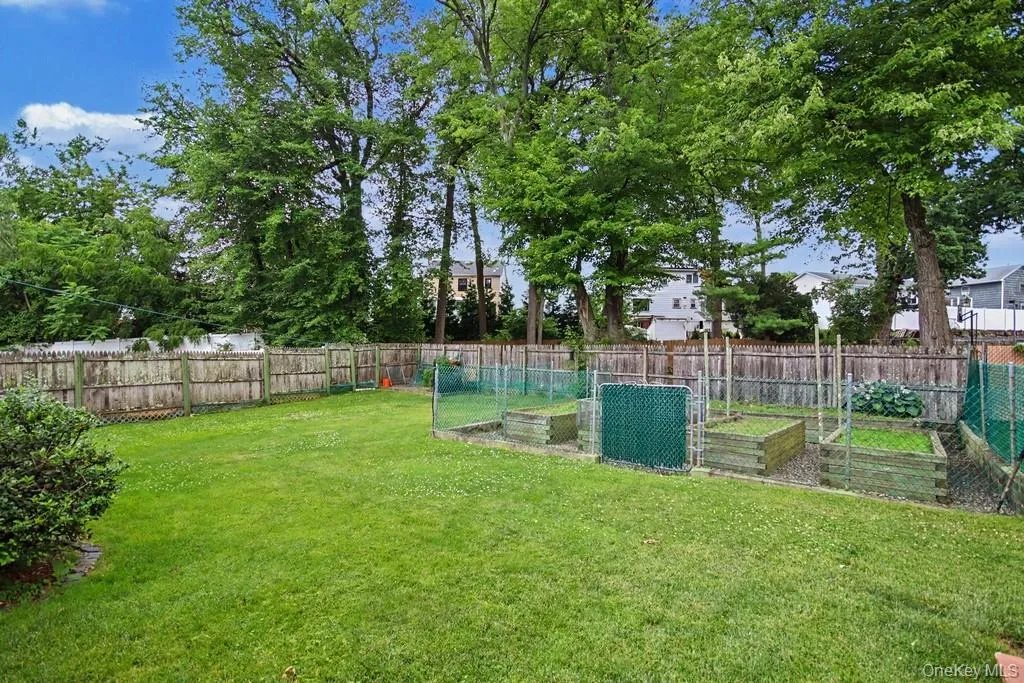 Fenced-in, level, rear yard w/plenty of room for gardening and/or recreation Fenced-in, level, rear yard w/plenty of room for gardening and/or recreation