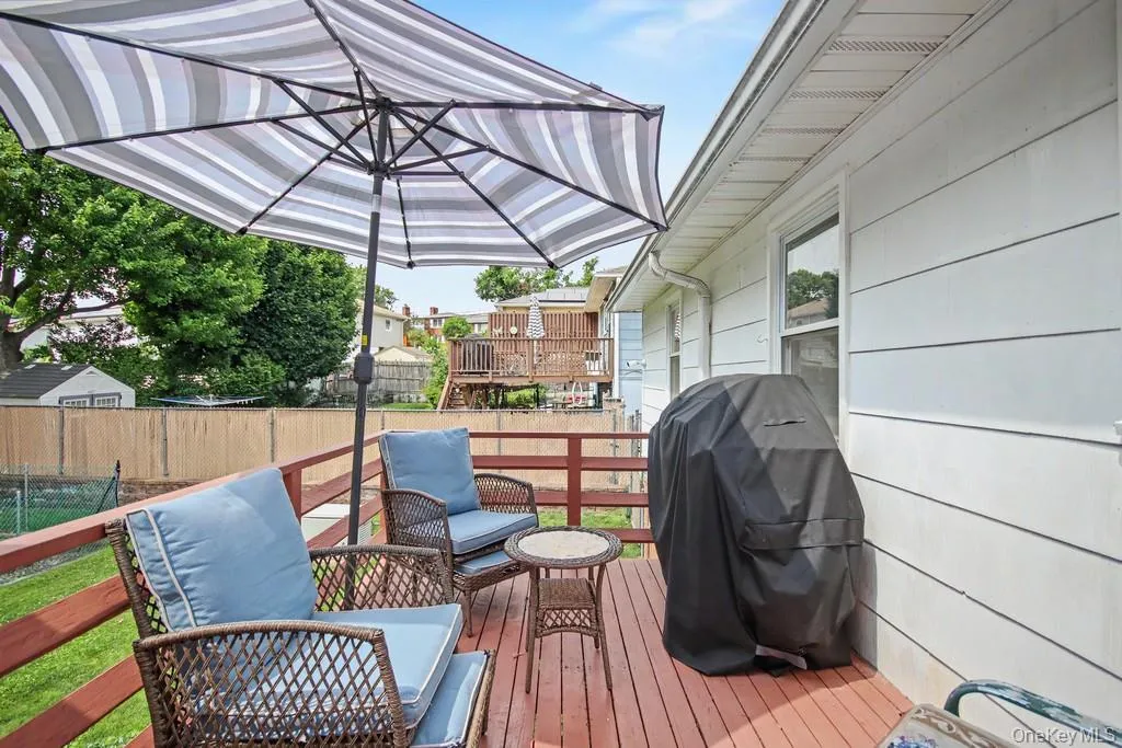 Rear deck accessible from the Kitchen. Rear deck accessible from the Kitchen.