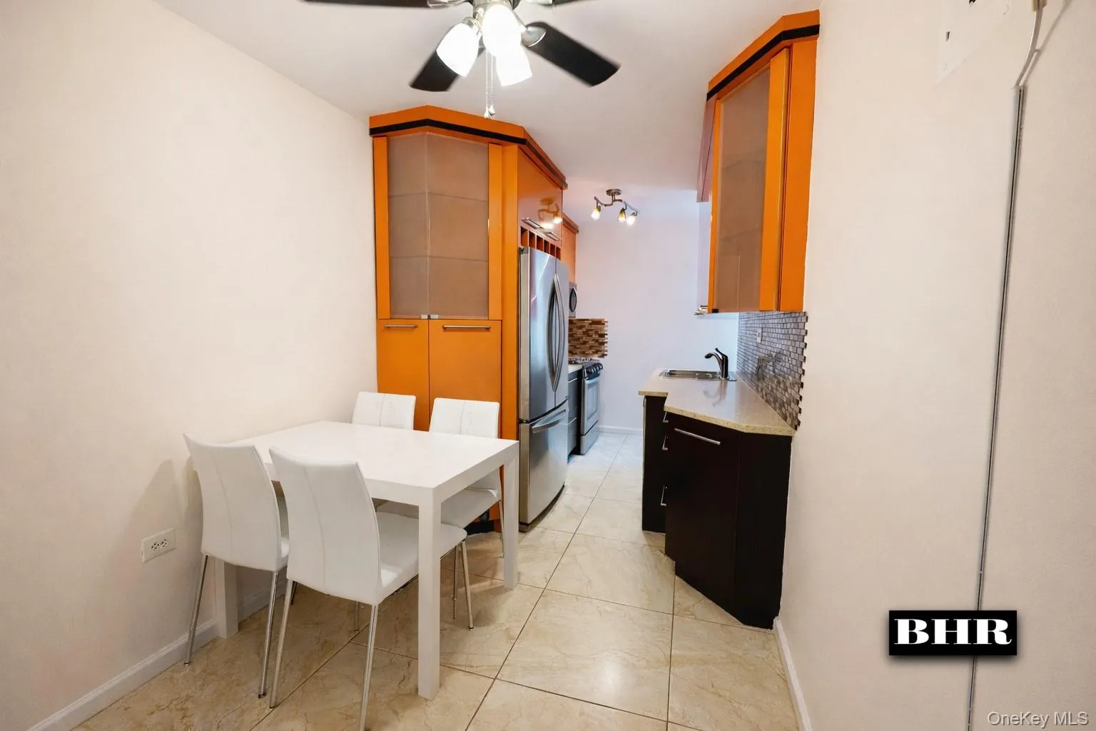 Dining space with ceiling fan and baseboards Dining space with ceiling fan and baseboards