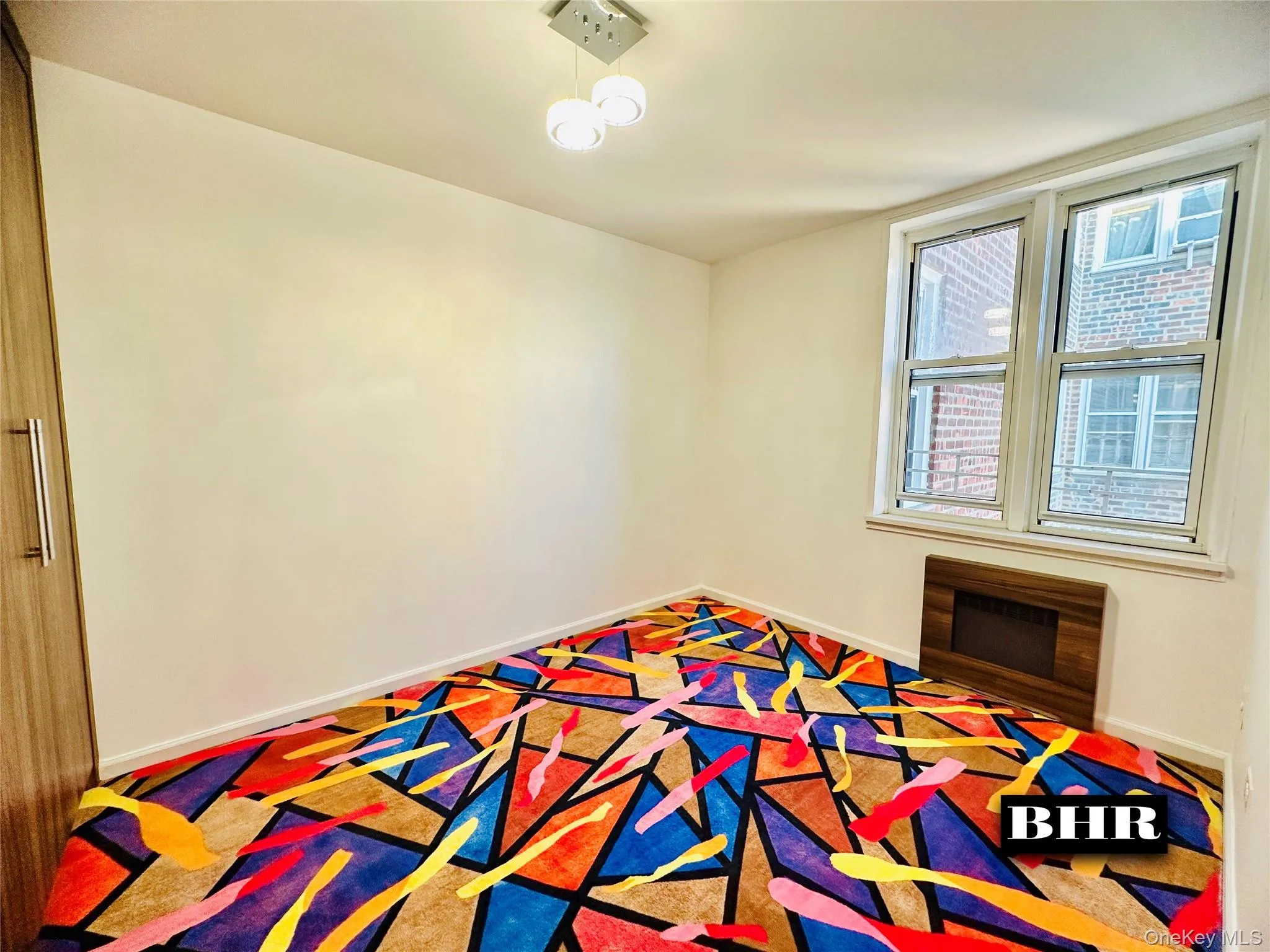 Unfurnished bedroom with baseboards and heating unit Unfurnished bedroom with baseboards and heating unit