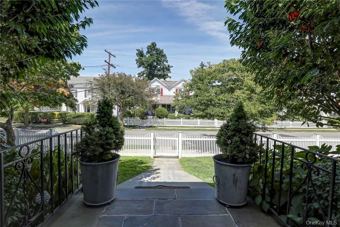 Fenced front yard with a gate Fenced front yard with a gate