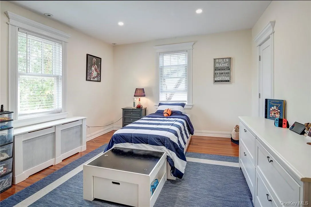 Bedroom featuring hardwood floors and recessed lighting Bedroom featuring hardwood floors and recessed lighting