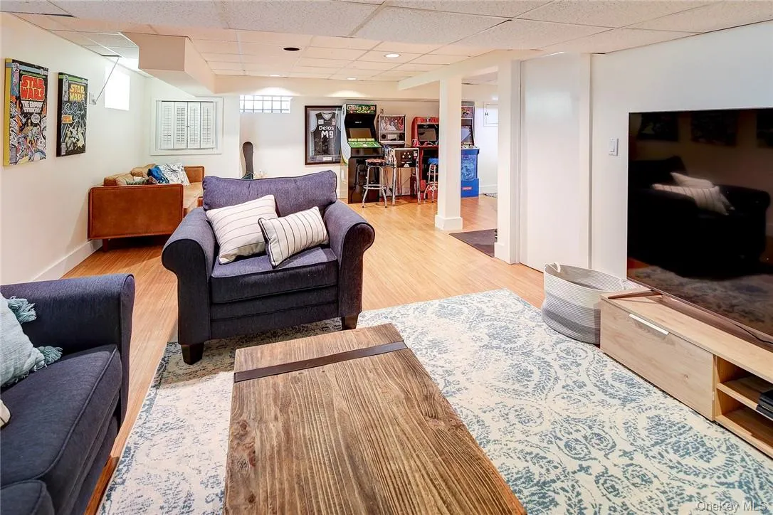 Finished basement offering play/recreation space. This opens to adjacent lndry rm Finished basement offering play/recreation space. This opens to adjacent lndry rm