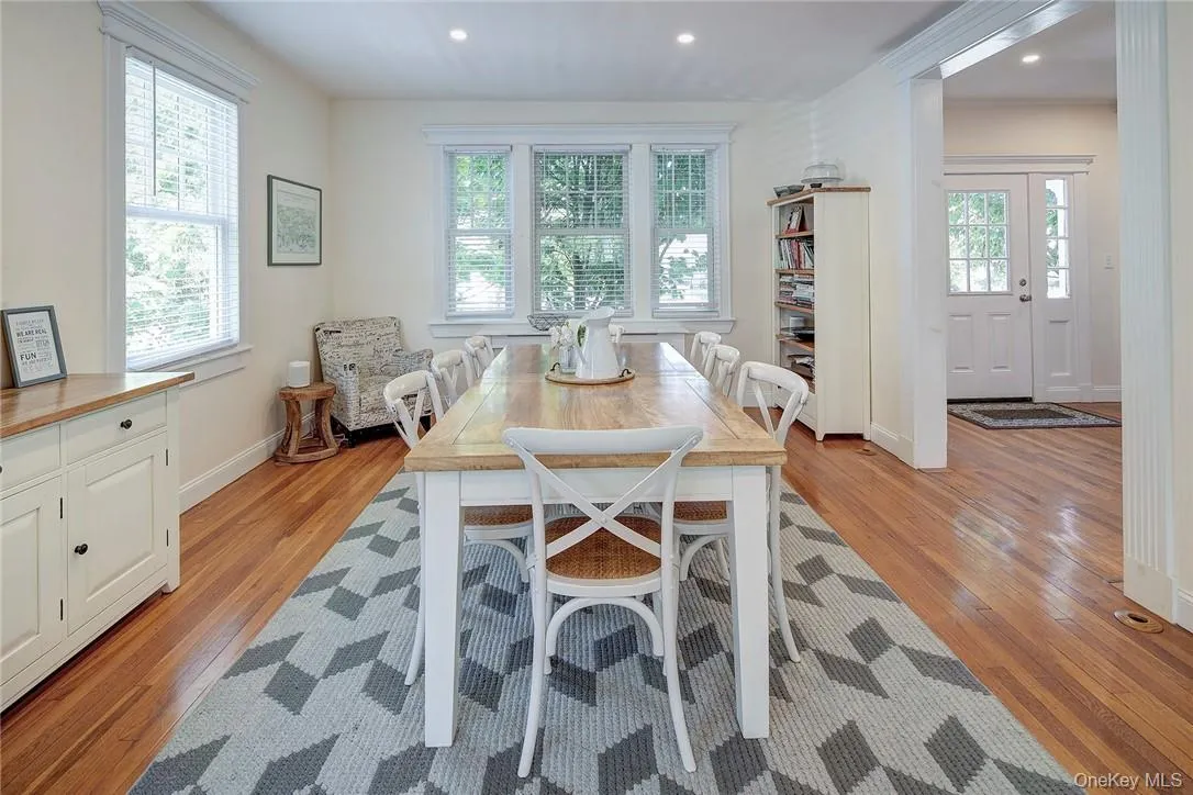 Dining room overlooking front of home, featuring light hardwood-flooring and recessed lighting Dining room overlooking front of home, featuring light hardwood-flooring and recessed lighting