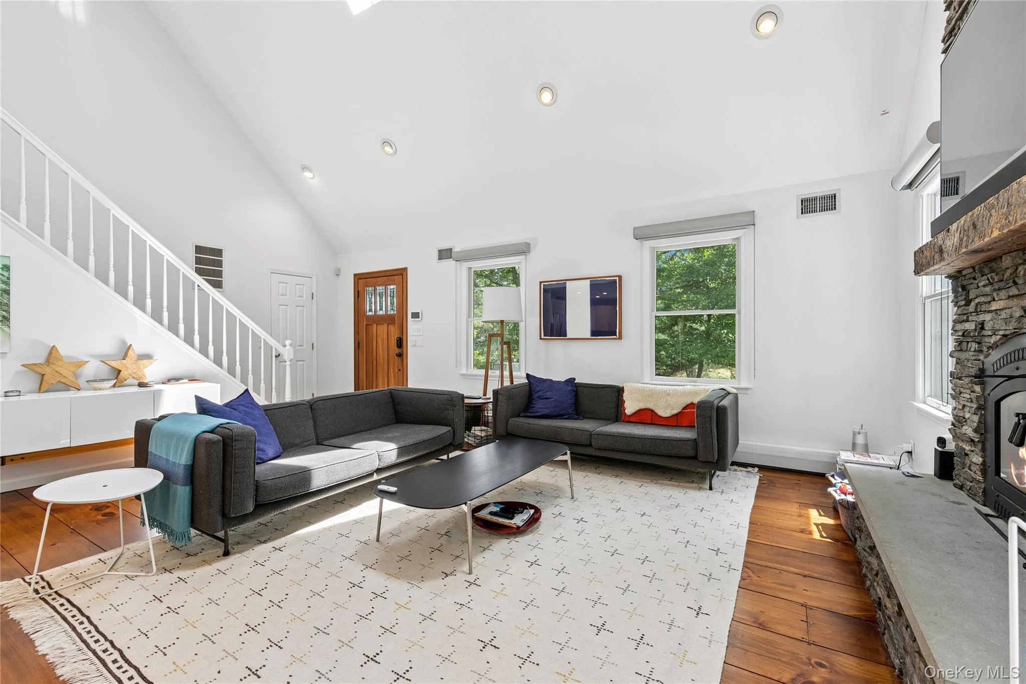 Living area with vaulted ceiling and recessed lighting Living area with vaulted ceiling and recessed lighting