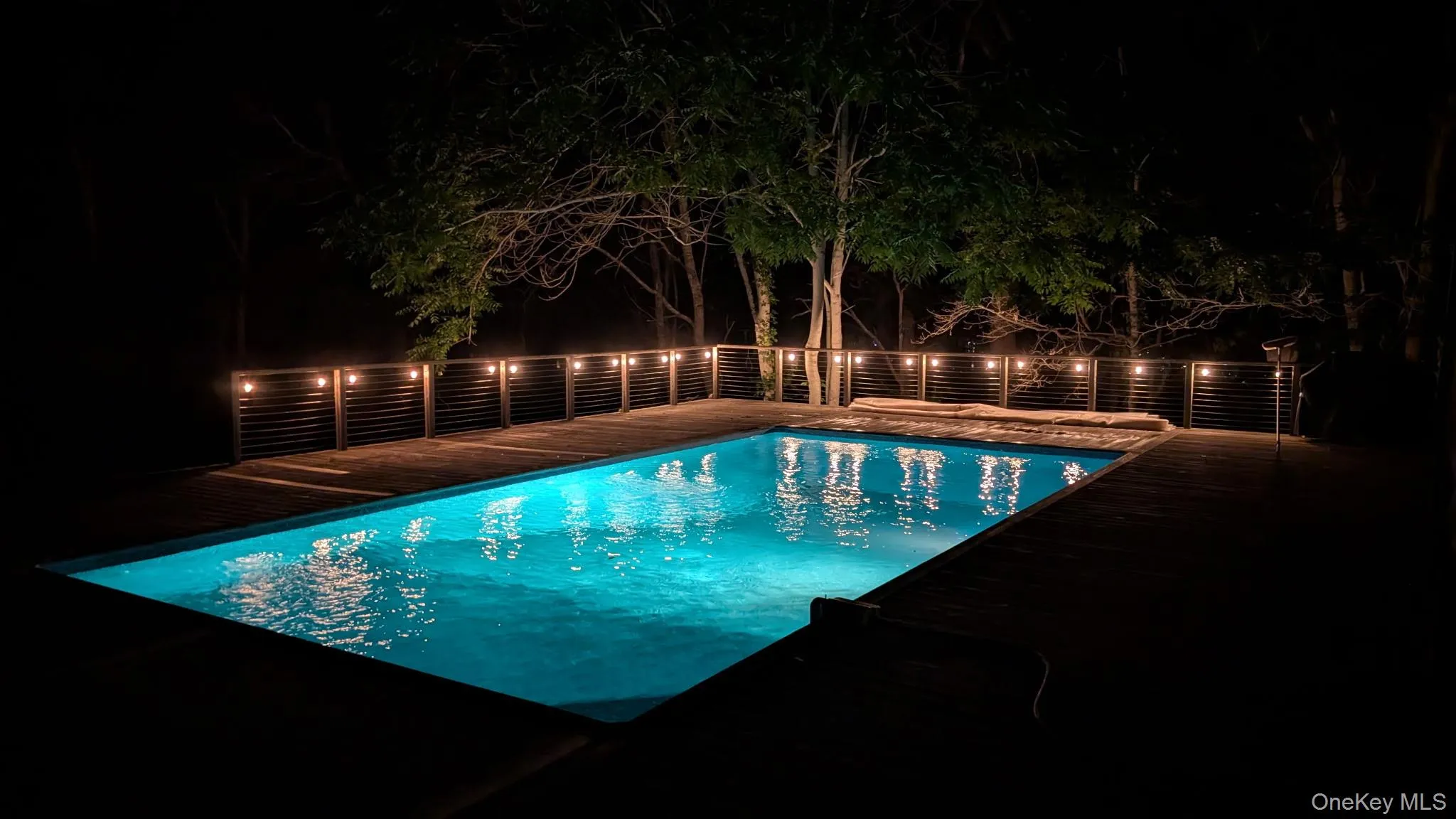 Pool and deck at night Pool and deck at night