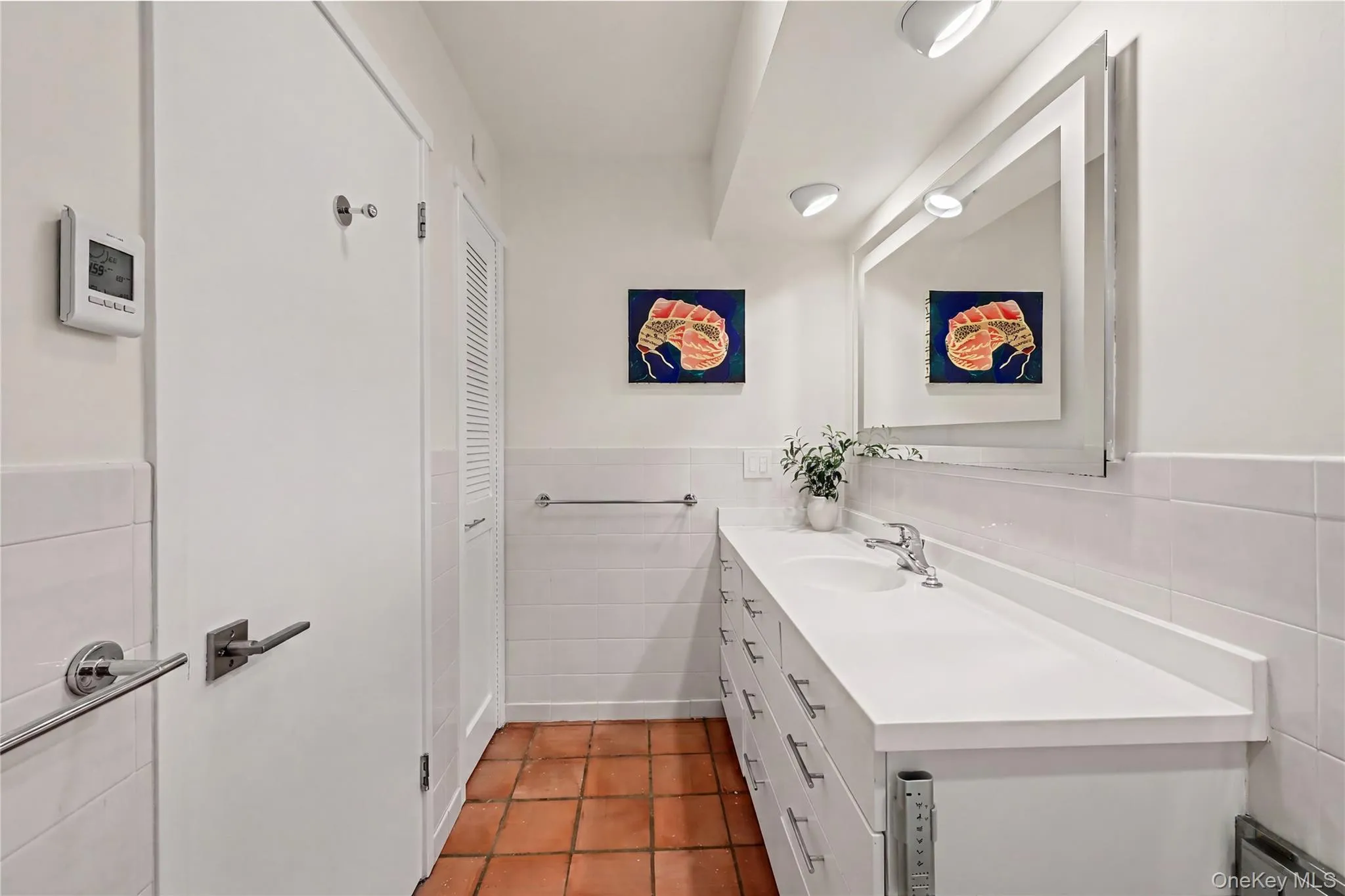 This vanity has great storage. In addition, there is a full lengthbuilt-in medicine cabinet on the opposite wall. This vanity has great storage. In addition, there is a full lengthbuilt-in medicine cabinet on the opposite wall.