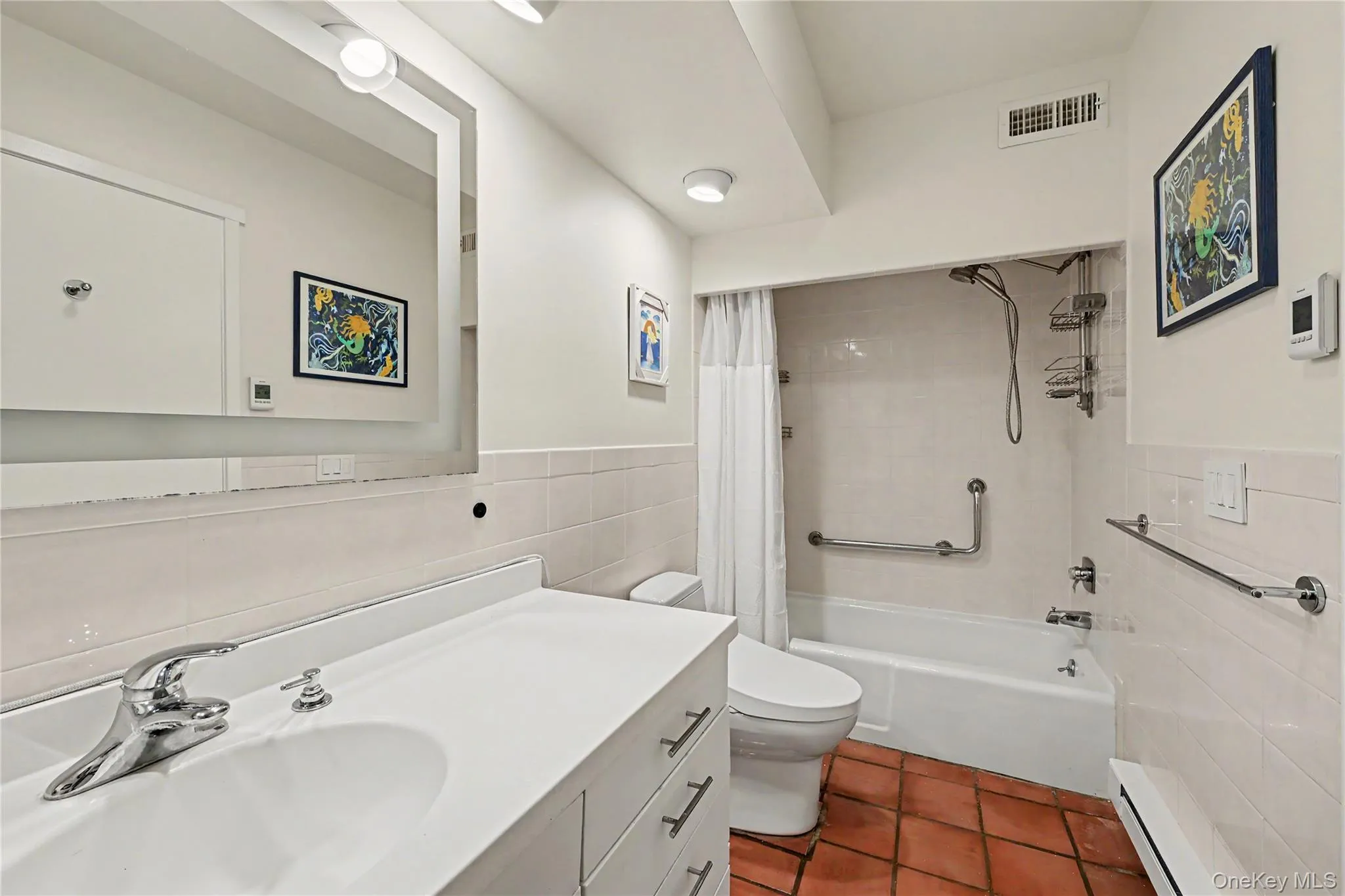 Tub/shower with safety grab-bars. Tub/shower with safety grab-bars.