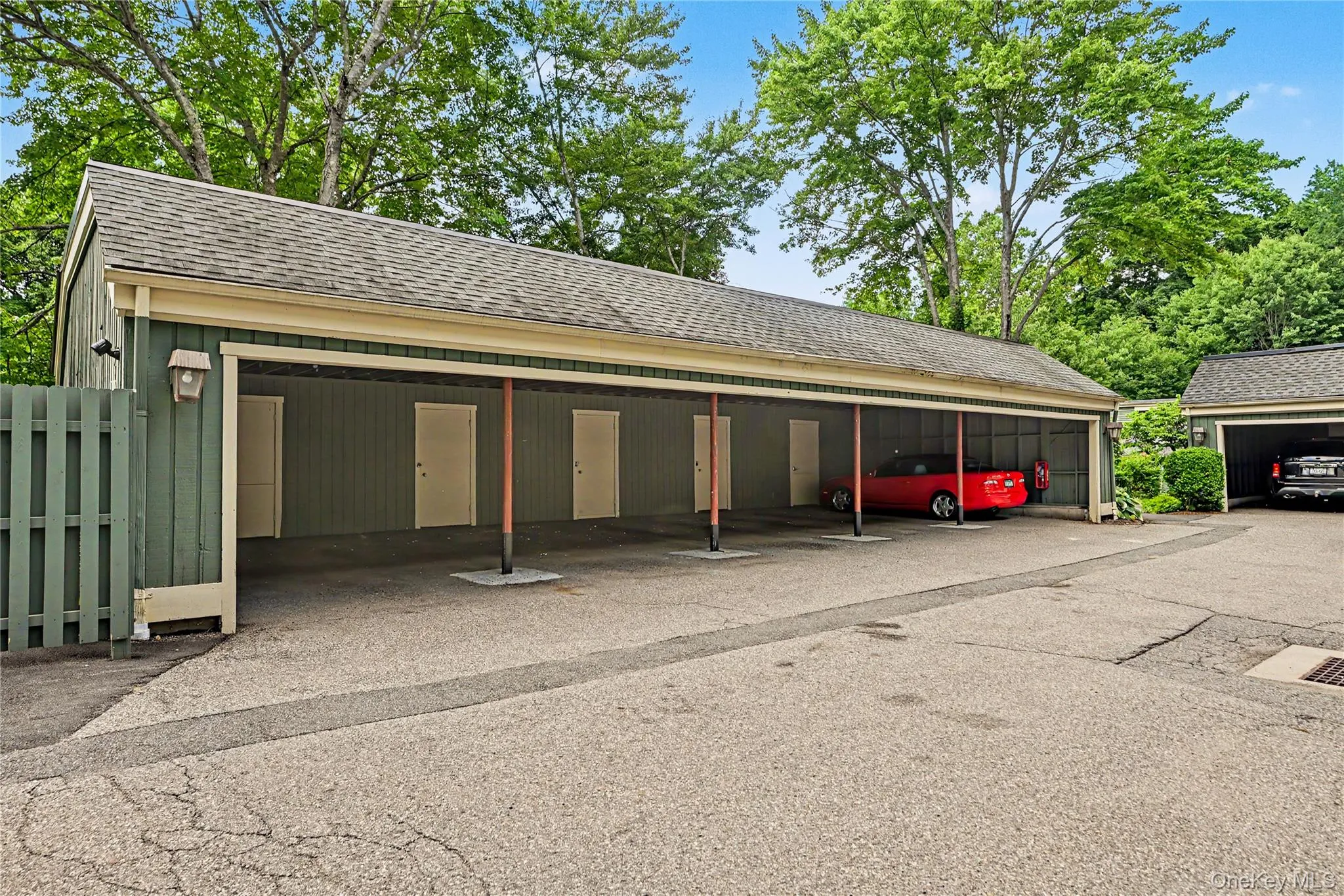 Carport with dedicated parking space in close proximity to the unit. (red car spot) Storage closet with custom shelving. Carport with dedicated parking space in close proximity to the unit. (red car spot) Storage closet with custom shelving.