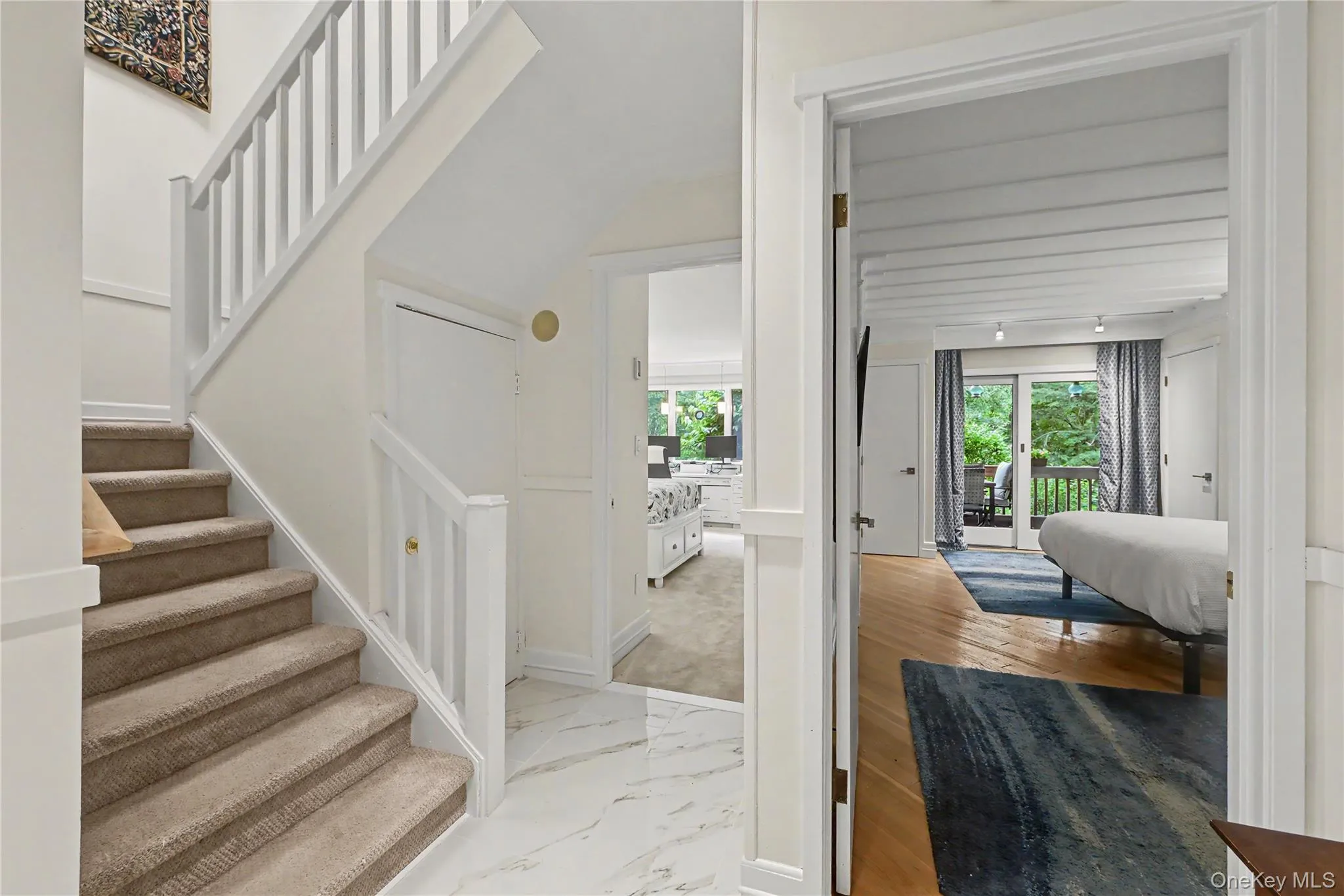 Lower level hallway with porcelain radiant heated floors. Lower level hallway with porcelain radiant heated floors.