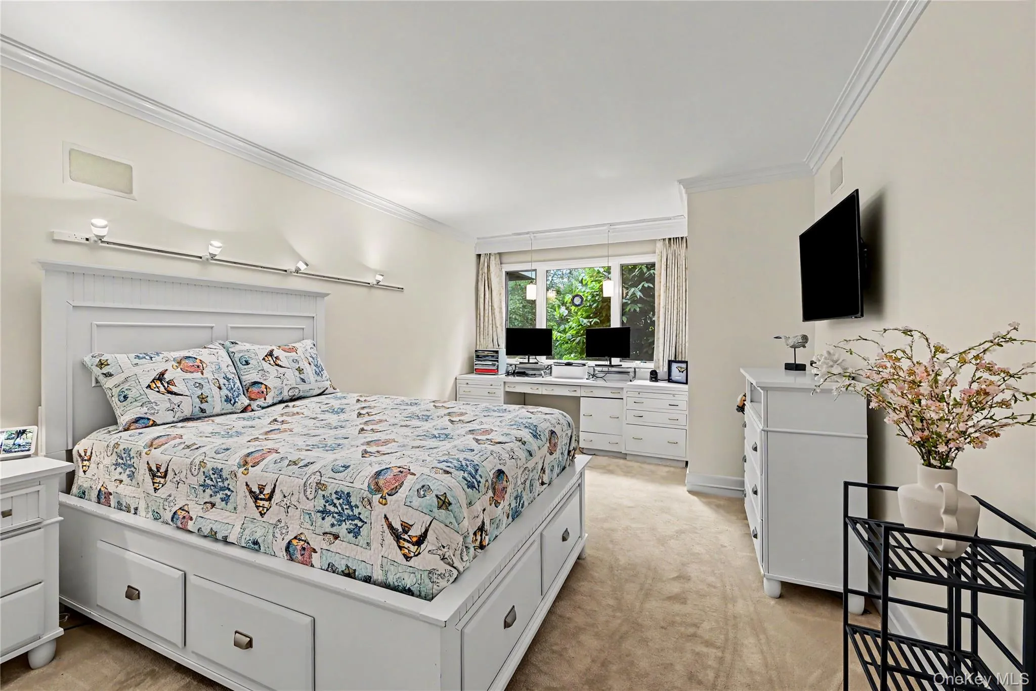 Bedroom with a wall of windows overlooking the wooded private backyard. Bedroom with a wall of windows overlooking the wooded private backyard.