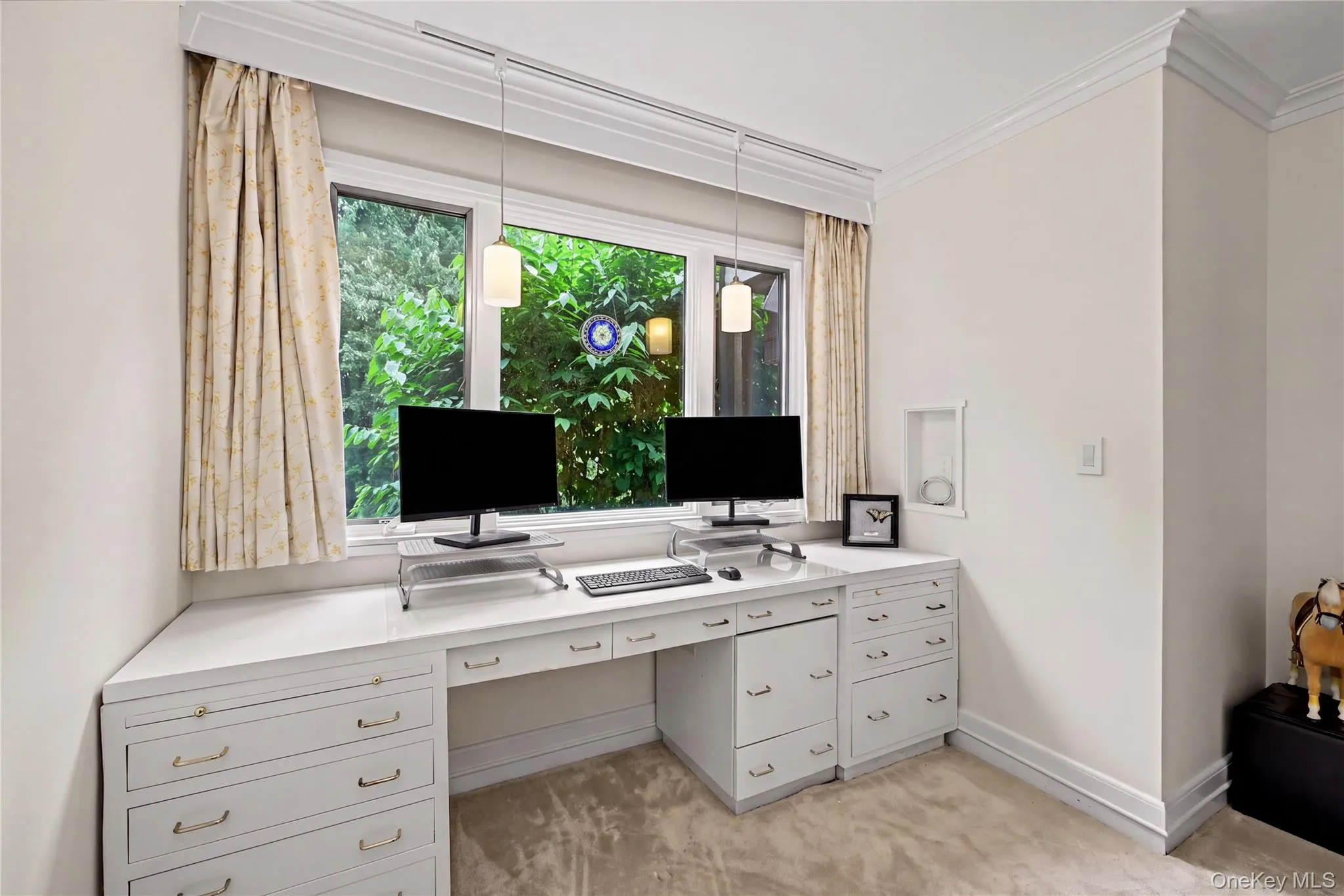 Custom designed wall-to-wall desk, with a wall of windows overlooking the beautiful trees. Custom designed wall-to-wall desk, with a wall of windows overlooking the beautiful trees.
