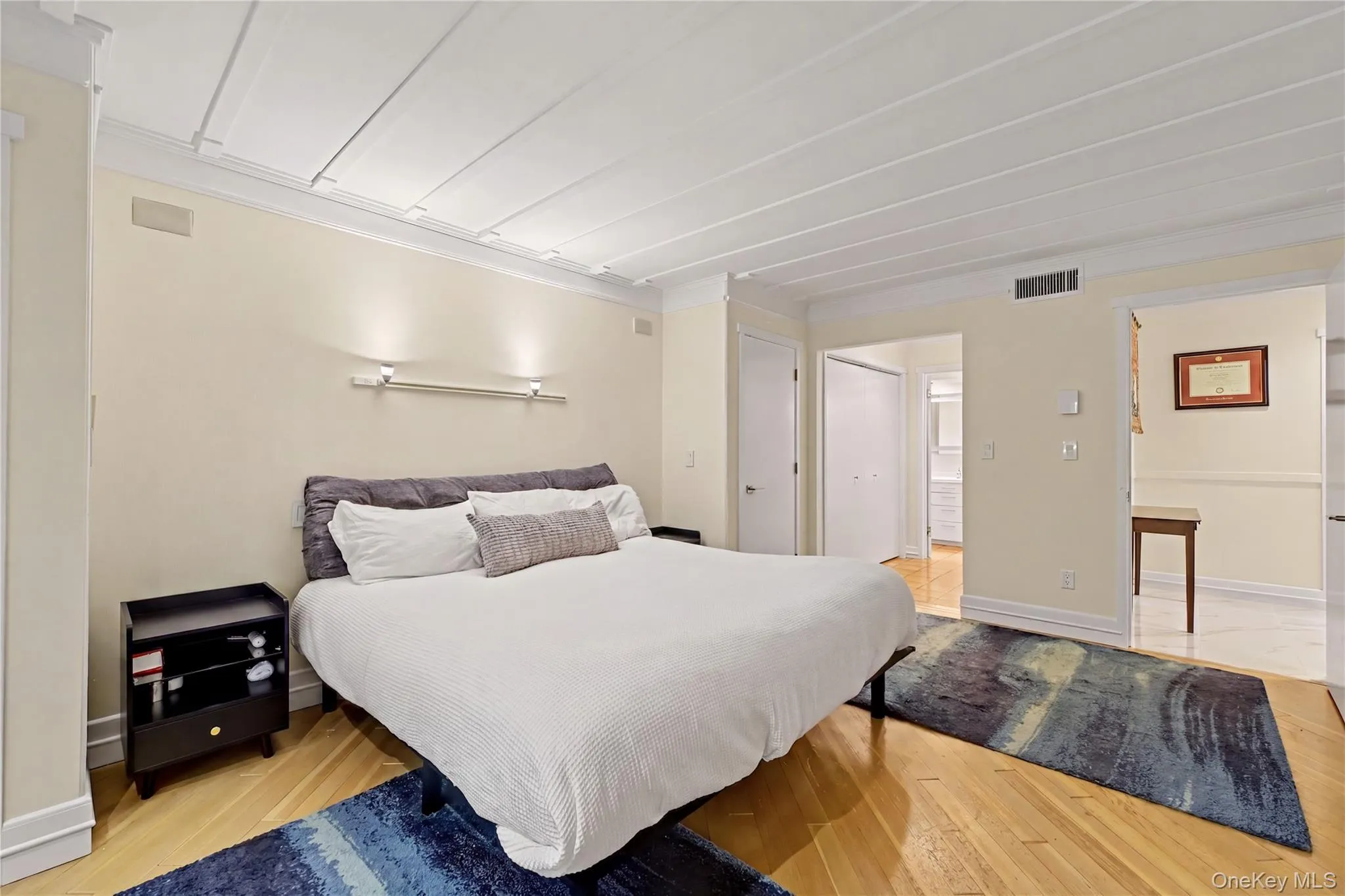 Spacious primary with a custom wood ceiling and hard-wood oak floors. Spacious primary with a custom wood ceiling and hard-wood oak floors.