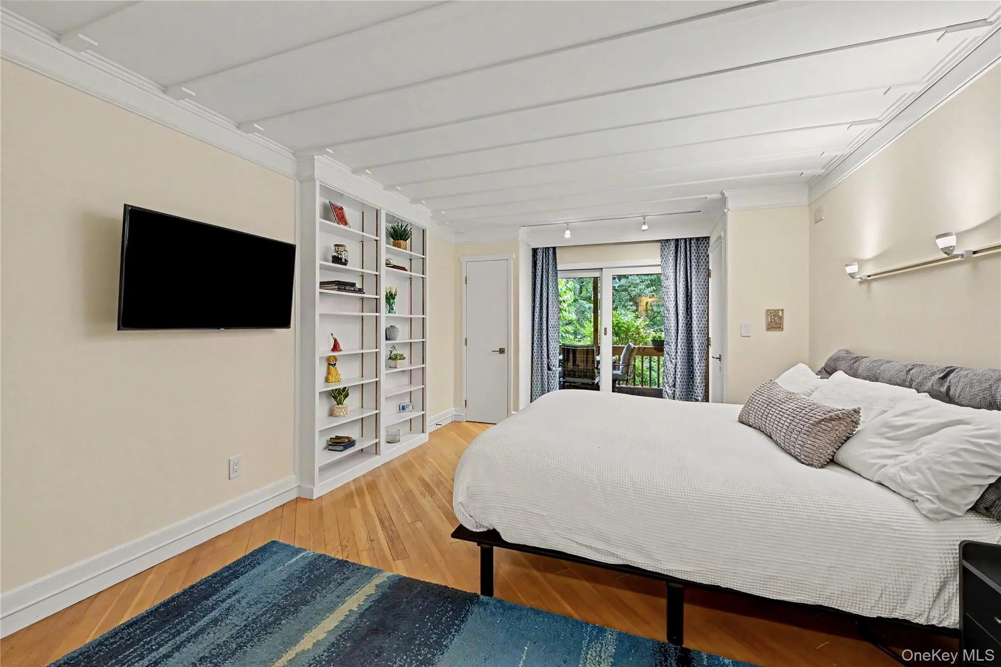Primary bedroom with a 6' slider leading to a private deck, overlooking the backyard. Primary bedroom with a 6' slider leading to a private deck, overlooking the backyard.