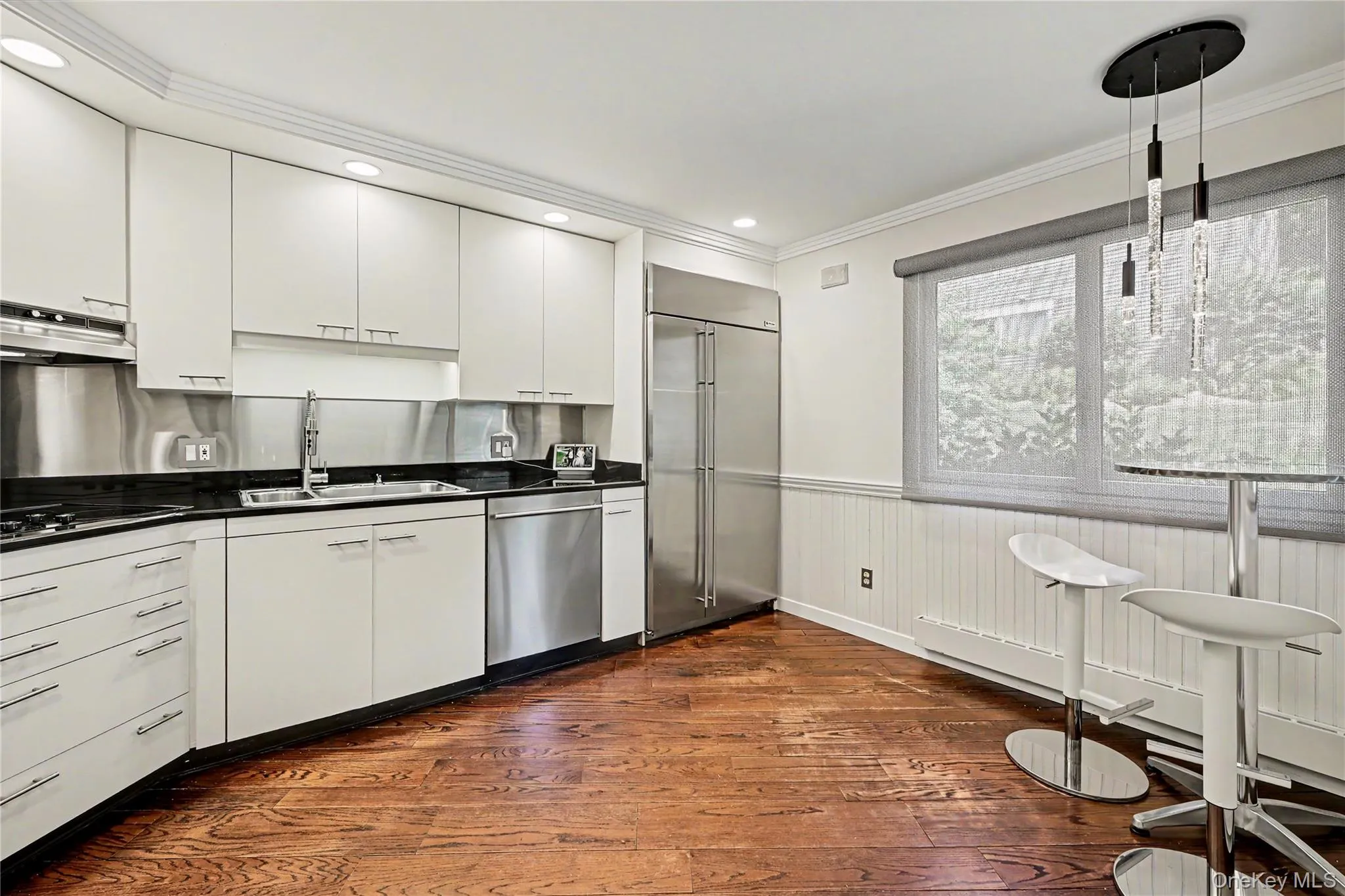 Gourmet Chef's Kitchen with stainless appliances. Corner windows with remote-control shades. Gourmet Chef's Kitchen with stainless appliances. Corner windows with remote-control shades.
