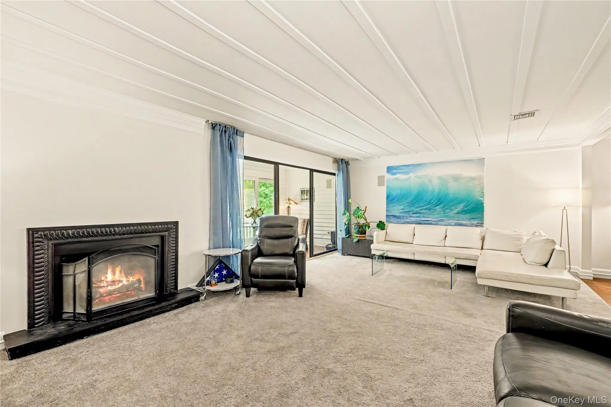 Hand carved wood surround wood-burning fireplace is the focal point of this room. Hand carved wood surround wood-burning fireplace is the focal point of this room.