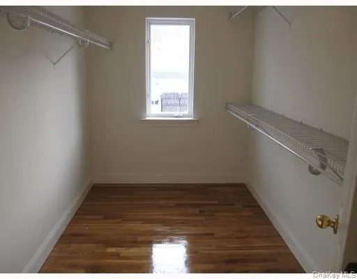 Huge walk in closet within primary bedroom suite Huge walk in closet within primary bedroom suite